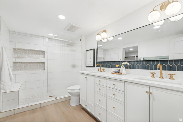 1010 West Maple Street Mapleton, UT 84664 - Photo 9 of 24 Dual vanity with white cabinetry, gold-tone hardware, and integrated sinks