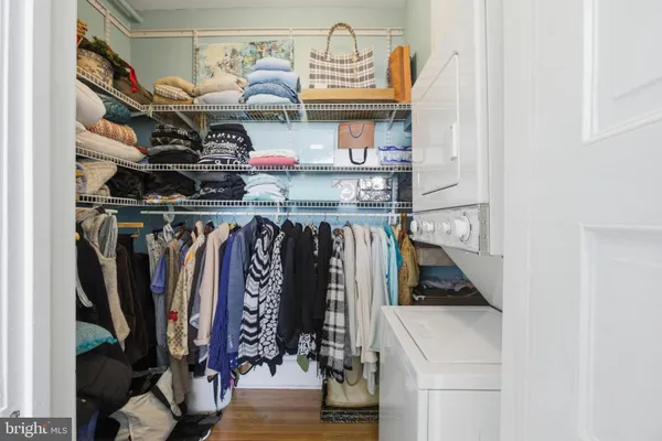 a utility room with multiple dryer and washer