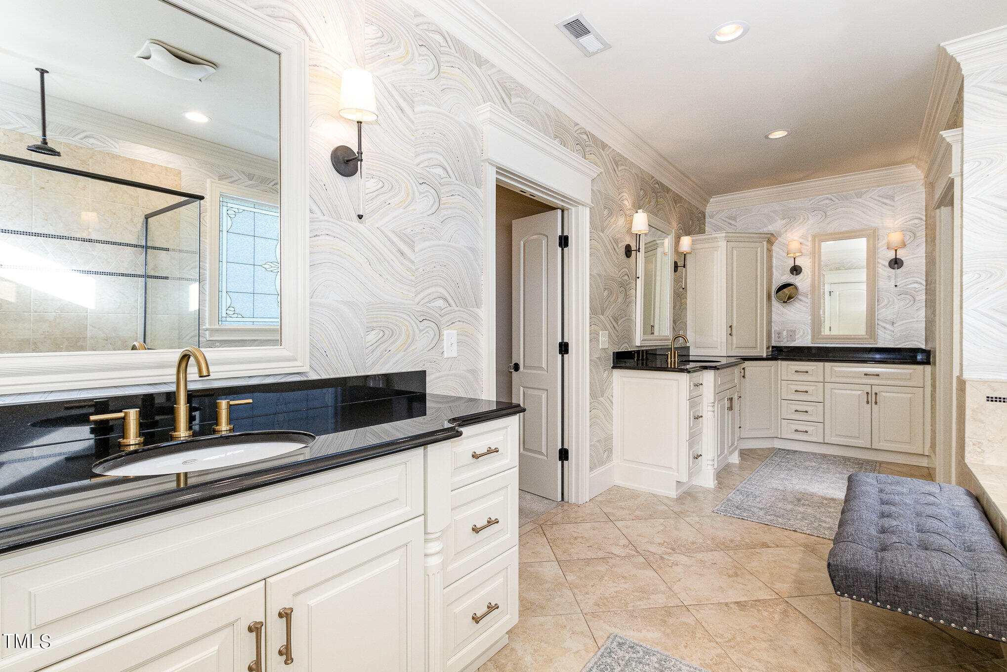 7814 Monument Lane Raleigh, NC 27615 - Photo 22 of 52 Dual vanities, corner storage, sconces and water closet