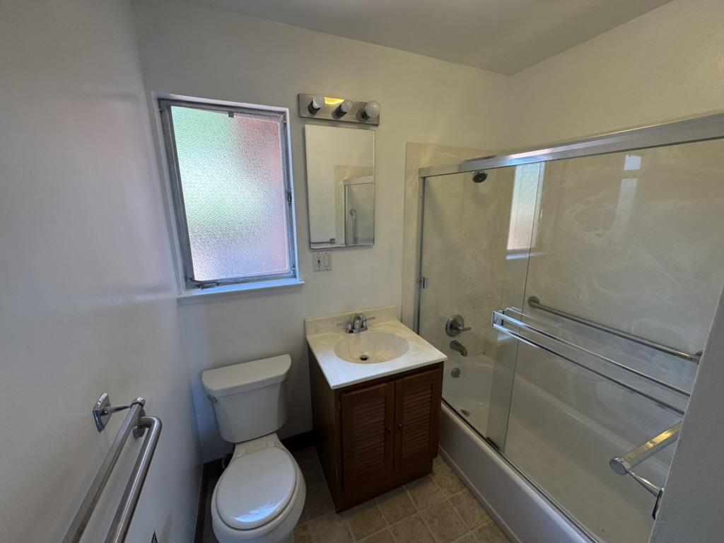 1625 Higgins Way Pacifica, CA 94044 - Photo 4 of 9 a bathroom with a toilet sink and mirror