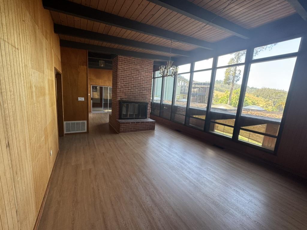 1625 Higgins Way Pacifica, CA 94044 - Photo 5 of 9 wooden floor in an empty room with a window