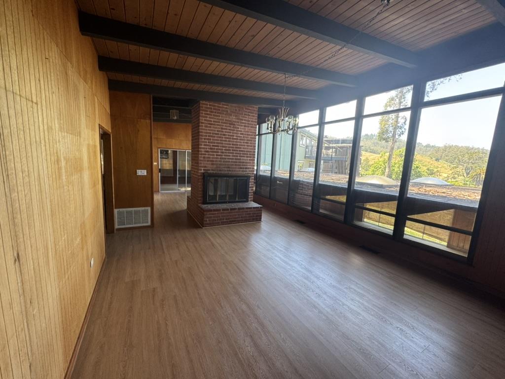 1625 Higgins Way Pacifica, CA 94044 - Photo 6 of 9 a view of livingroom with furniture and fireplace