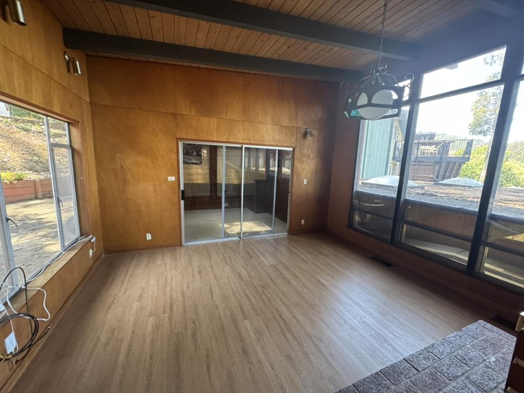 1625 Higgins Way Pacifica, CA 94044 - Photo 7 of 9 a view of empty room with wooden floor and fan