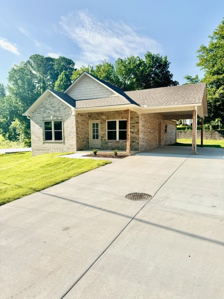 210 Church Street Ripley, TN 38063 - Photo 1 of 14 View of front of property featuring a front yard and a carport