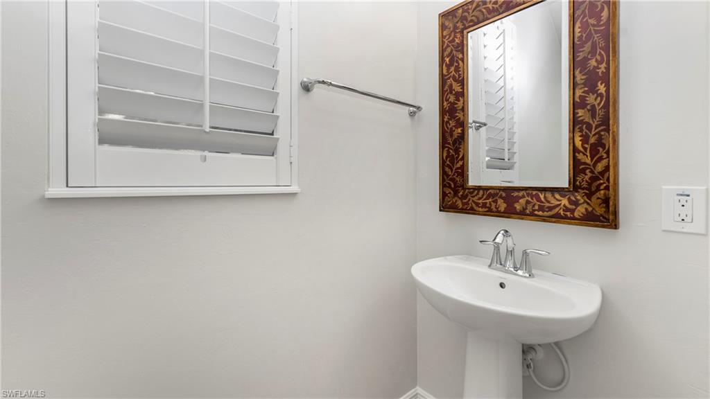 1238 Kendari Terrace Naples, FL 34113 - Photo 13 of 50 Bathroom with baseboards