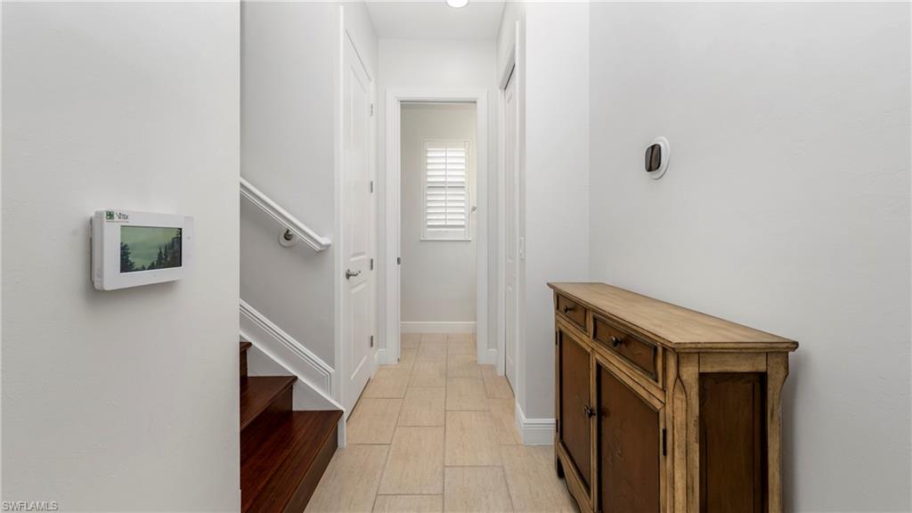 1238 Kendari Terrace Naples, FL 34113 - Photo 14 of 50 Corridor with baseboards