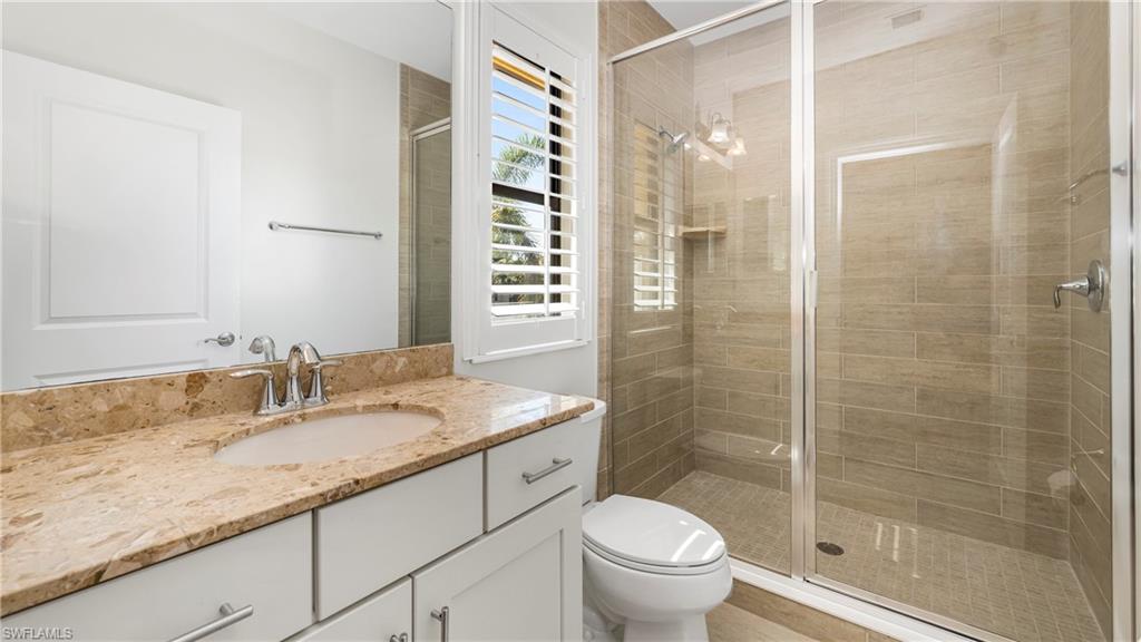 1238 Kendari Terrace Naples, FL 34113 - Photo 24 of 50 Full bathroom featuring vanity and a stall shower