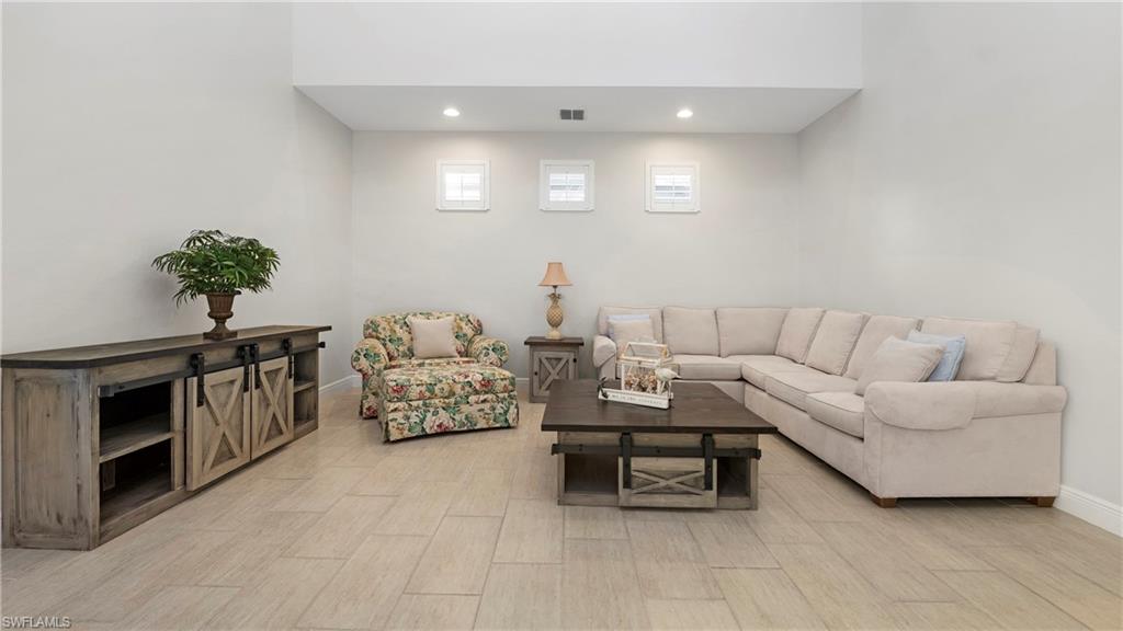 1238 Kendari Terrace Naples, FL 34113 - Photo 4 of 50 Living area featuring recessed lighting and wood finish floors