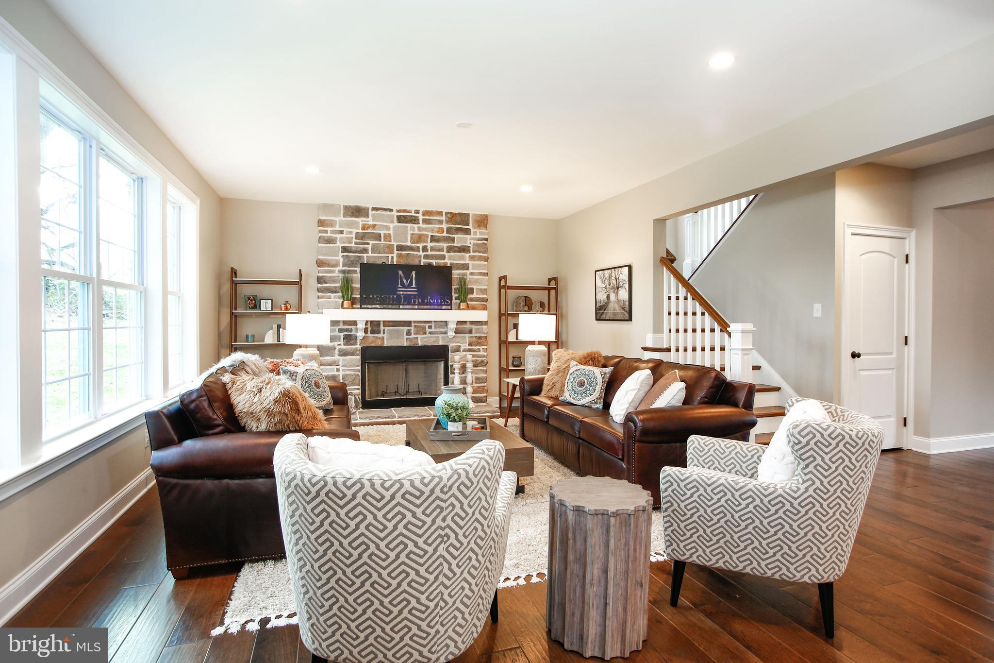 239 South Fairville Road Chadds Ford, PA 19317 - Photo 9 of 16 a living room with fireplace furniture and a large window