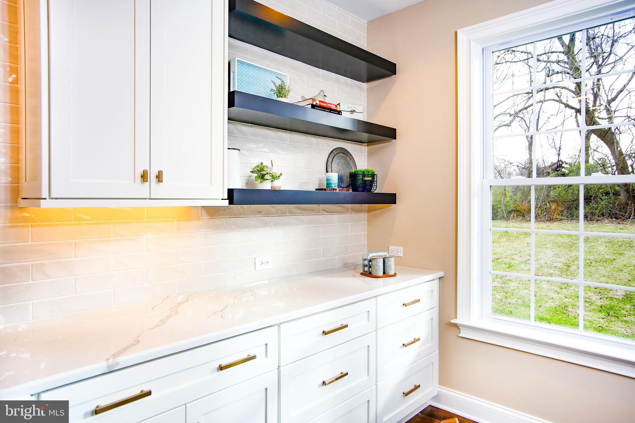 239 South Fairville Road Chadds Ford, PA 19317 - Photo 10 of 16 a kitchen with stainless steel appliances cabinets and a large window