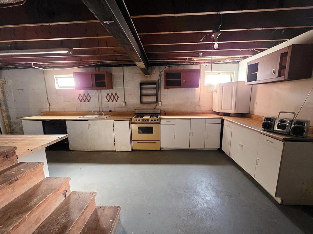 3520 Dixonville Road Marion Center, PA 15759 - Photo 23 of 30 a kitchen with white cabinets and white appliances