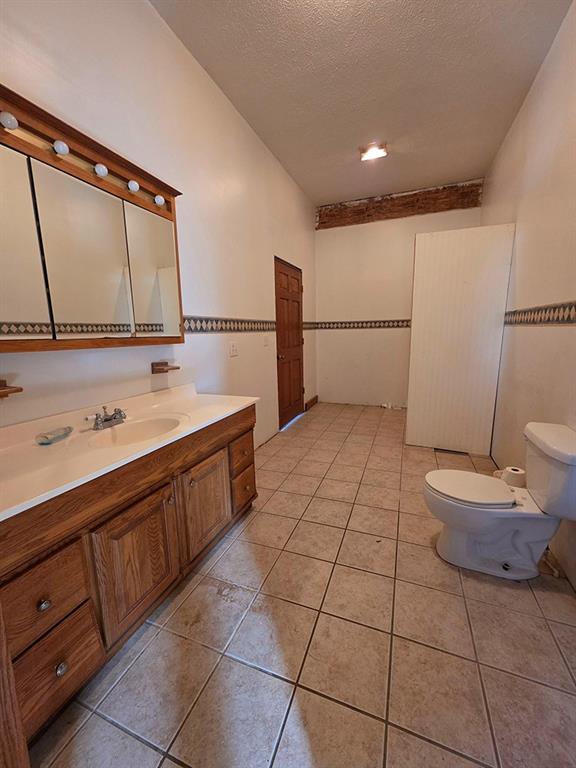 3520 Dixonville Road Marion Center, PA 15759 - Photo 10 of 30 a bathroom with a sink a toilet and mirror