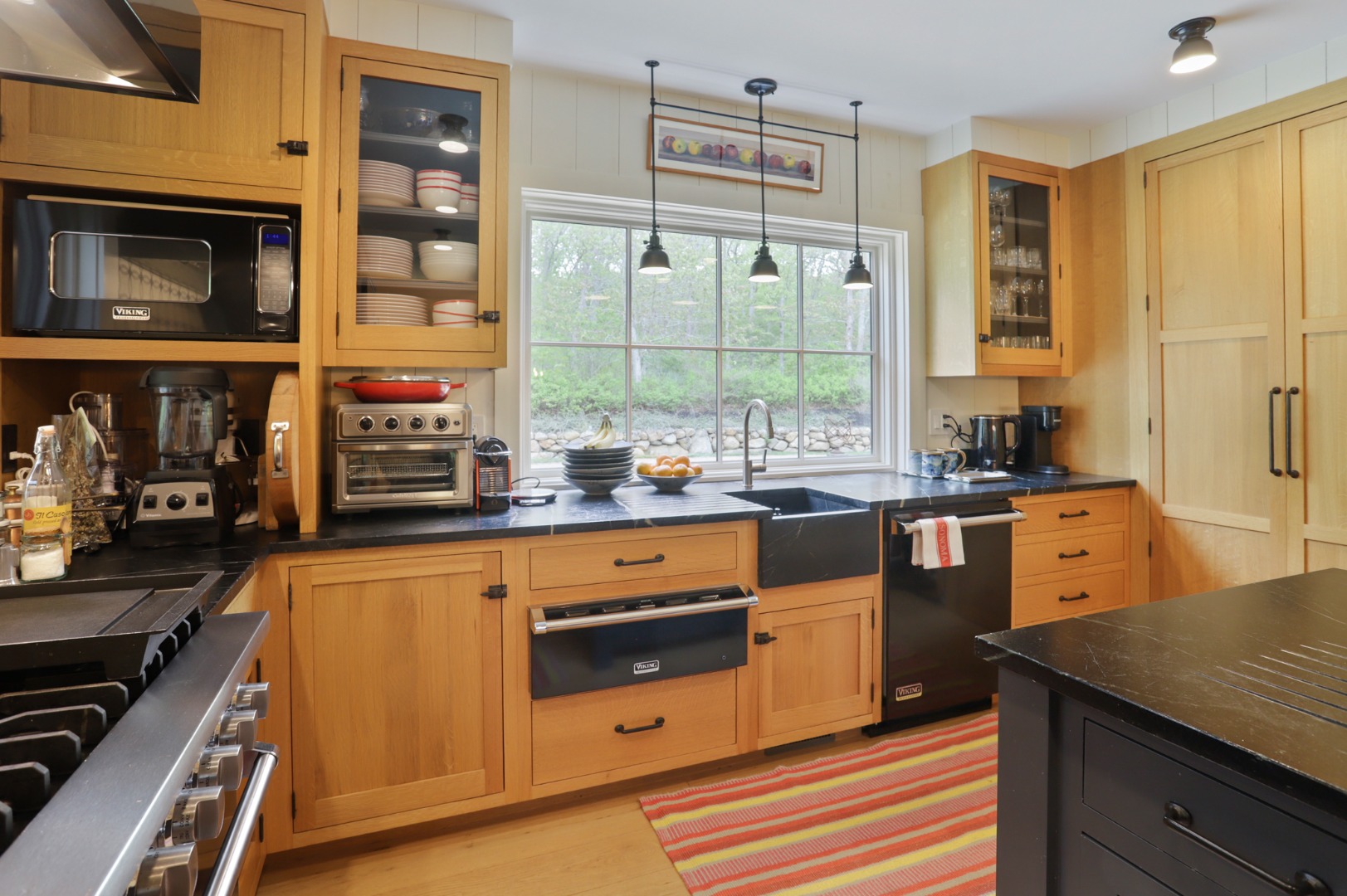 9 Ridge Hill Road Chilmark, MA 02535 - Photo 7 of 48 a kitchen with stainless steel appliances a stove and a microwave