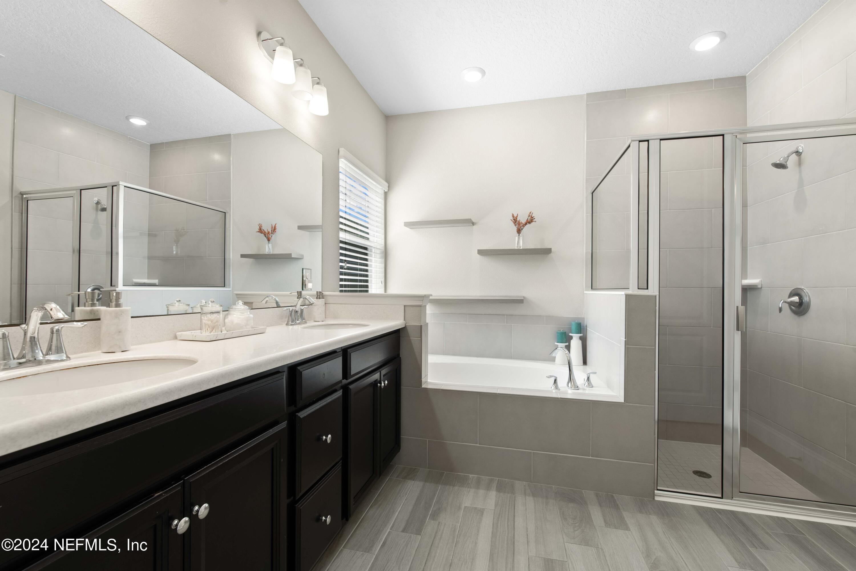 2672 Alexia Circle Jacksonville, FL 32246 - Photo 15 of 33 a bathroom with a double vanity sink mirror and shower