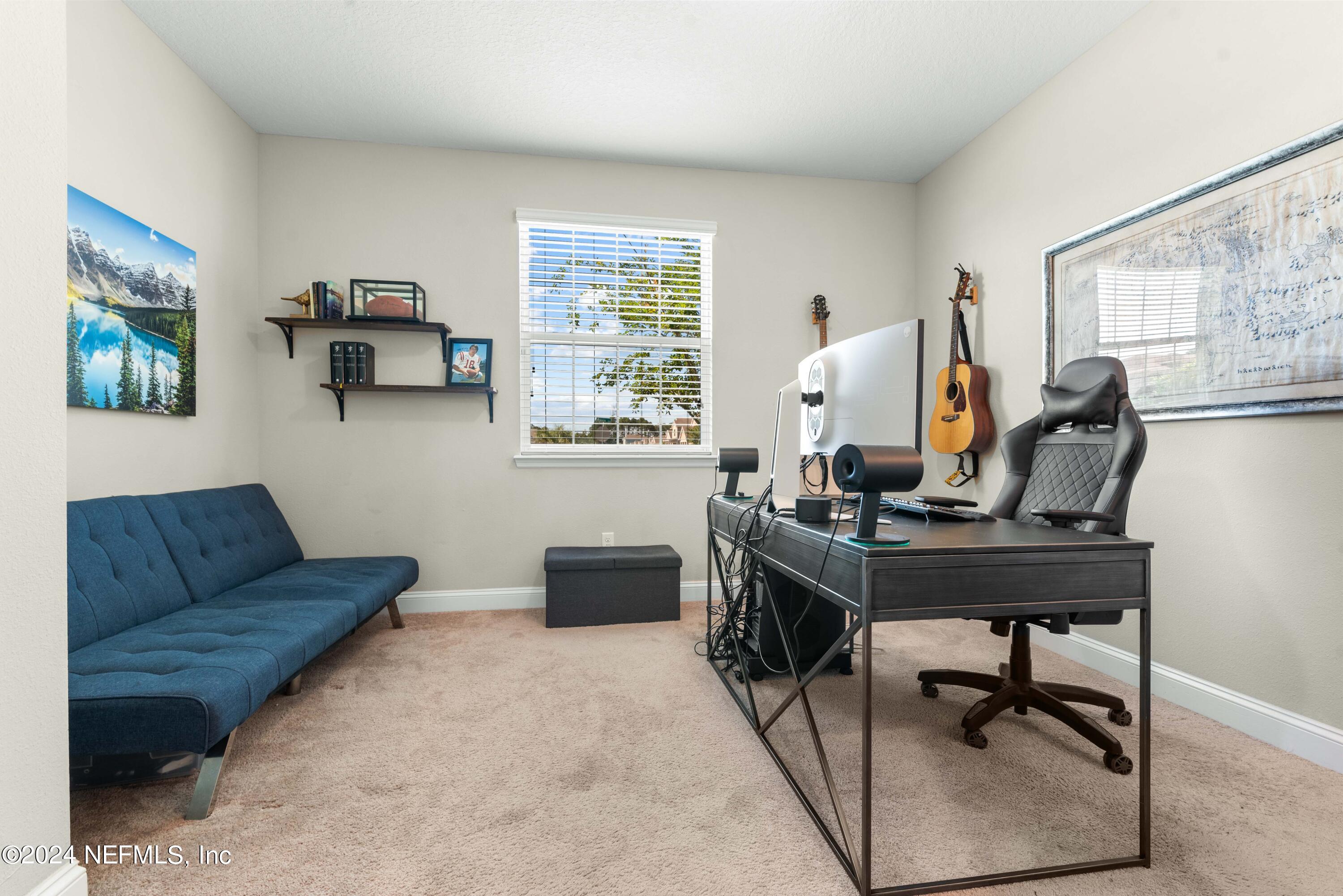 2672 Alexia Circle Jacksonville, FL 32246 - Photo 18 of 33 a view of a workspace with furniture and a window