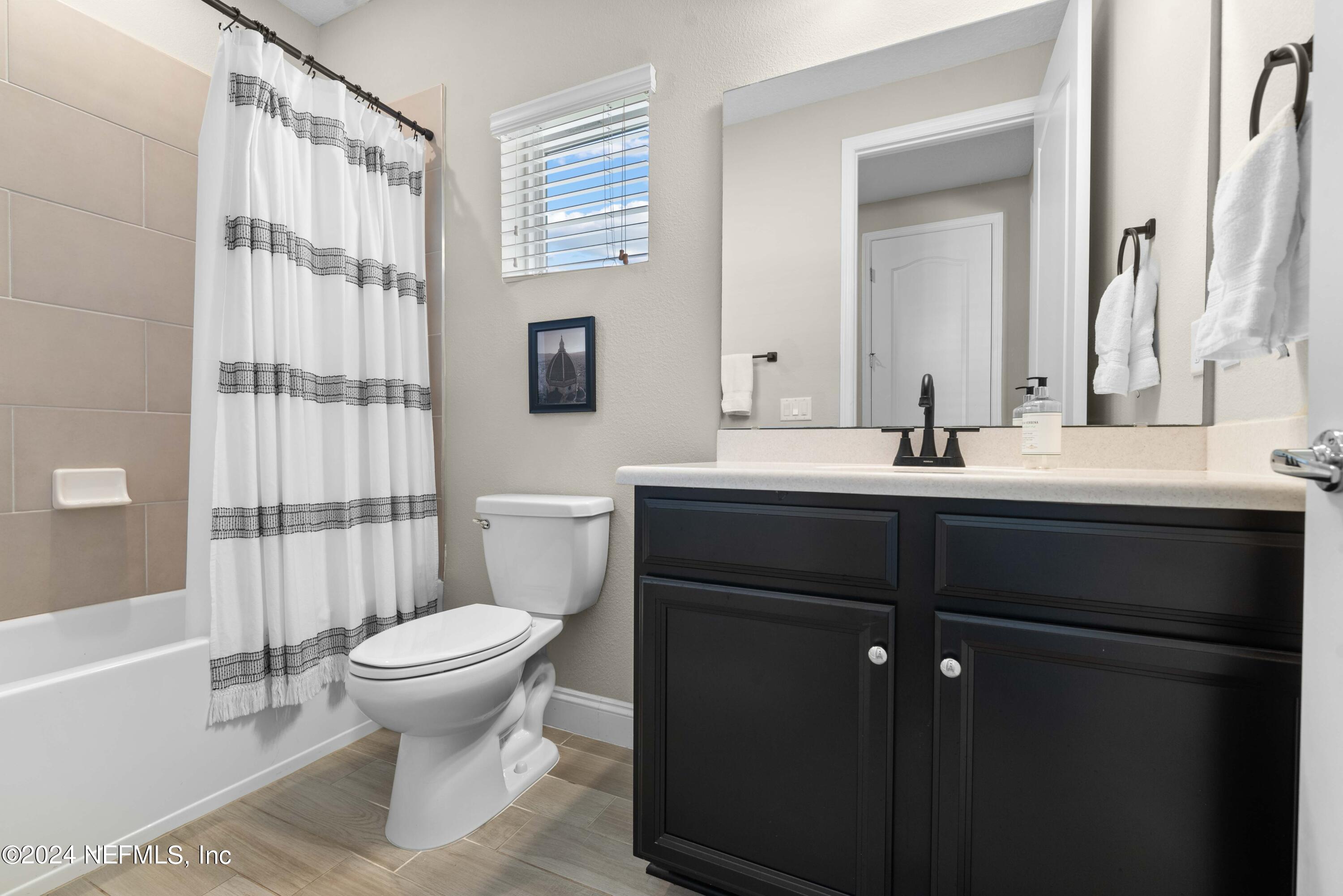 2672 Alexia Circle Jacksonville, FL 32246 - Photo 19 of 33 a bathroom with a sink toilet and shower