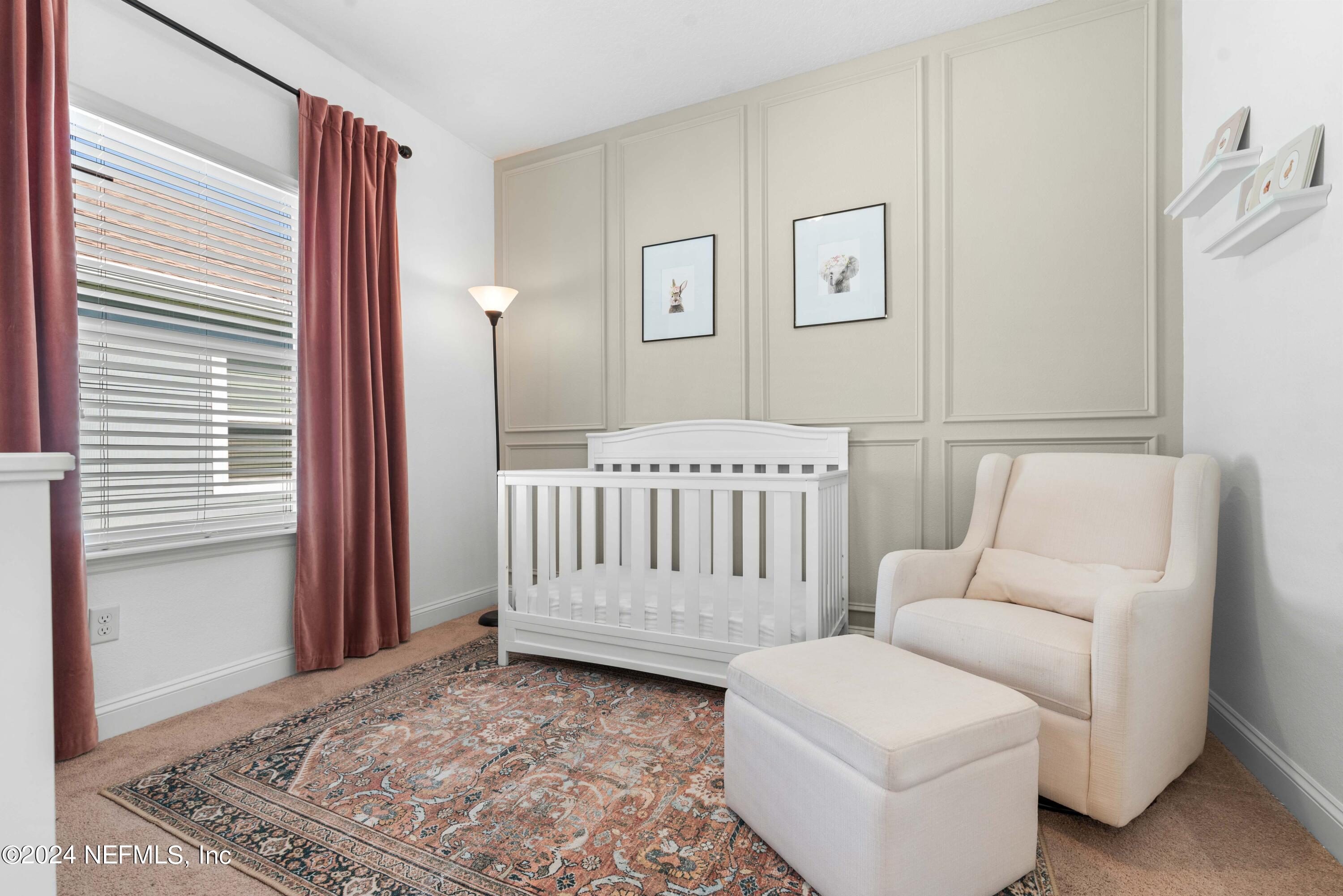 2672 Alexia Circle Jacksonville, FL 32246 - Photo 20 of 33 a view of a bedroom with furniture and window