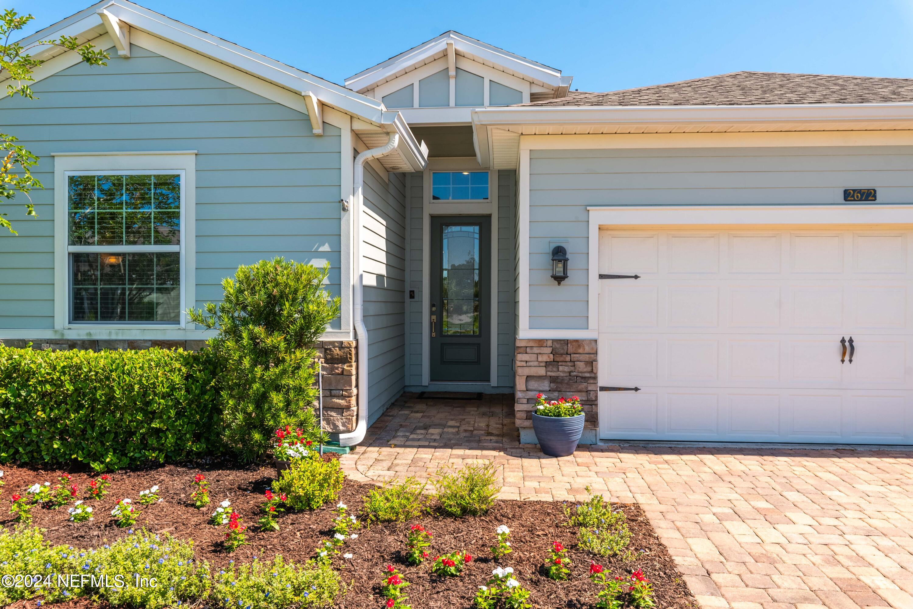 2672 Alexia Circle Jacksonville, FL 32246 - Photo 2 of 33 a front view of a house with a yard
