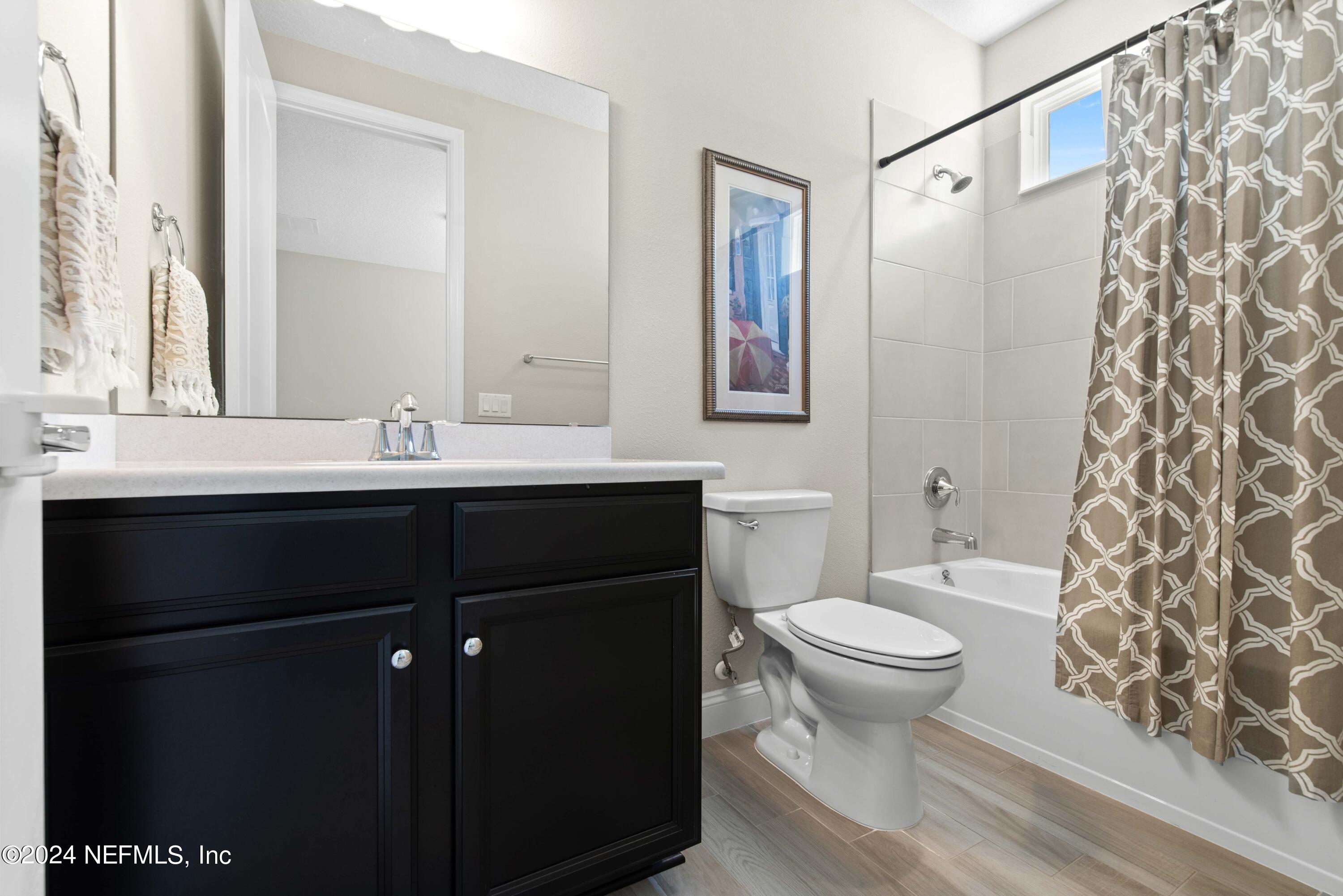 2672 Alexia Circle Jacksonville, FL 32246 - Photo 22 of 33 a bathroom with a sink and a toilet