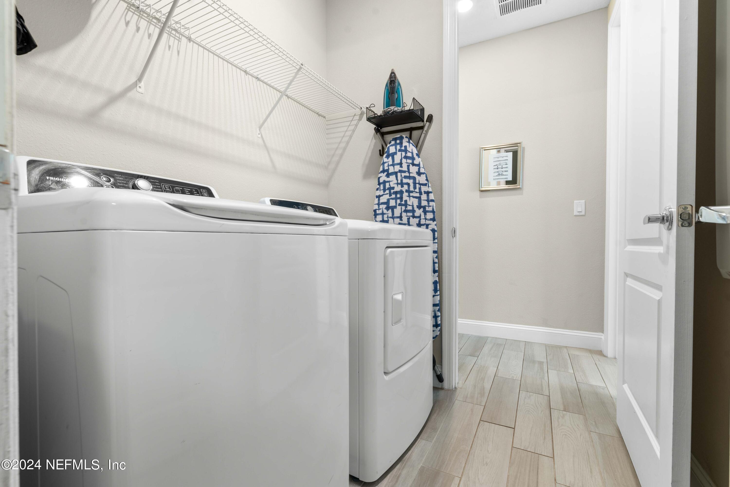 2672 Alexia Circle Jacksonville, FL 32246 - Photo 23 of 33 a utility room with dryer and washer