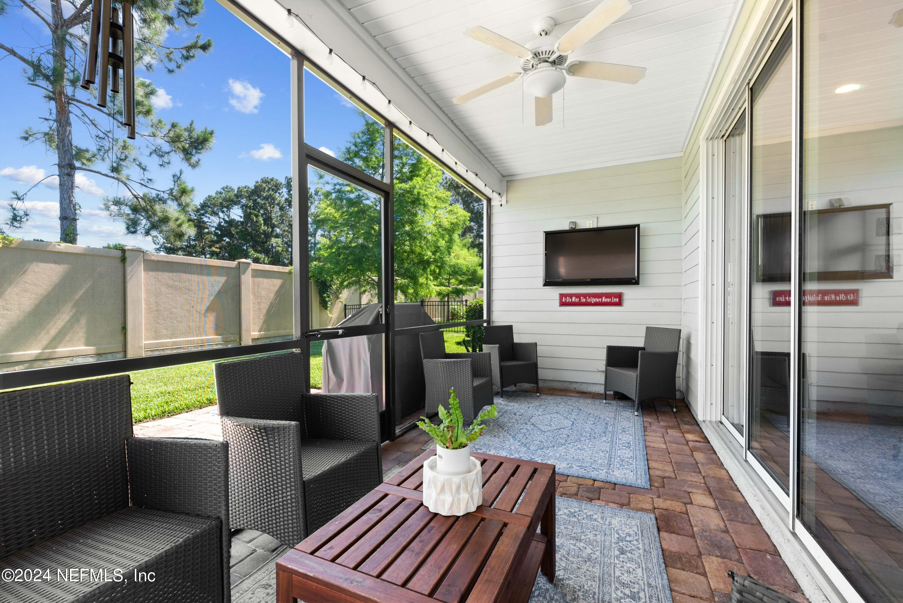 2672 Alexia Circle Jacksonville, FL 32246 - Photo 25 of 33 a living room with furniture and a flat screen tv