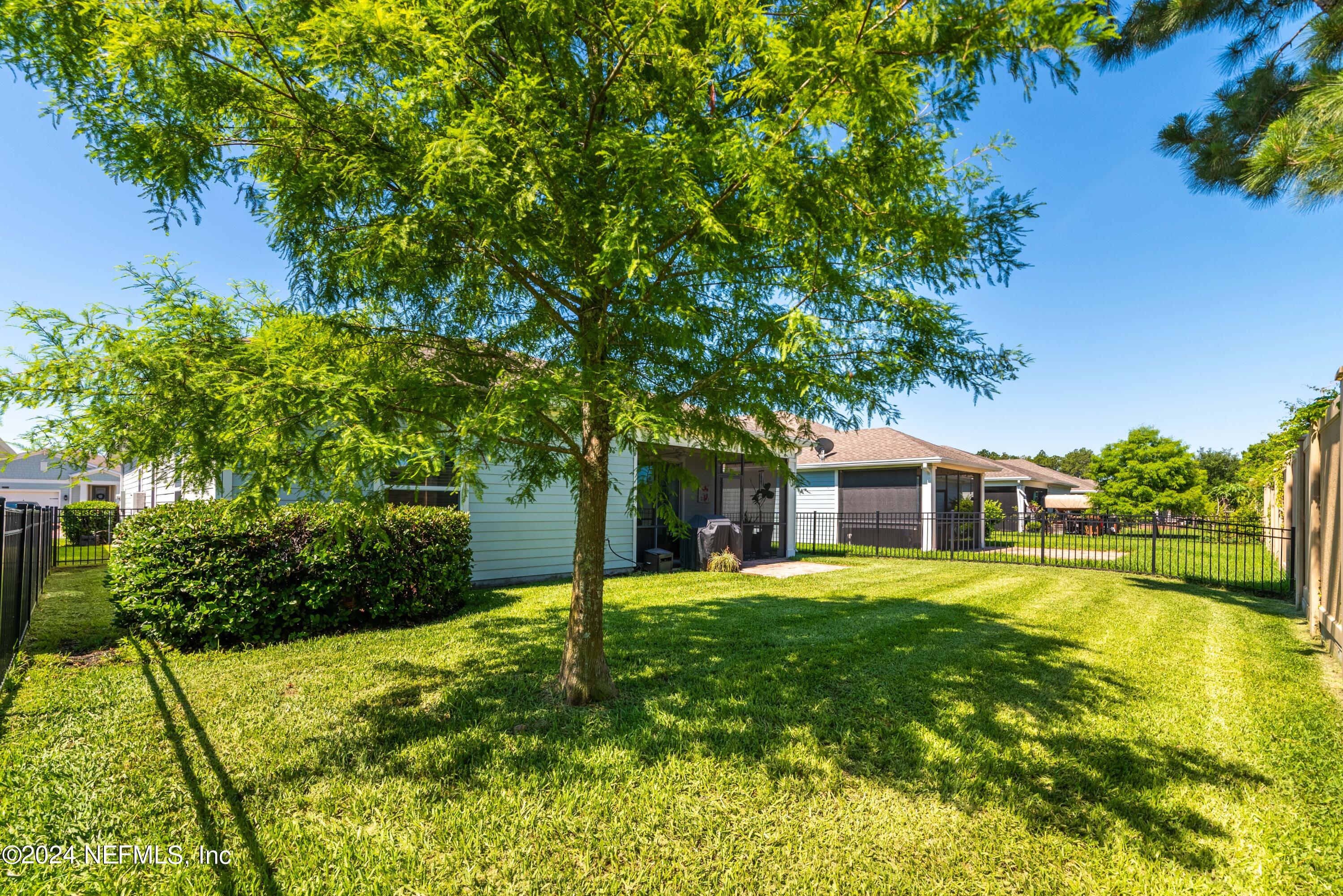 2672 Alexia Circle Jacksonville, FL 32246 - Photo 28 of 33 a white house with a big yard plants and large trees