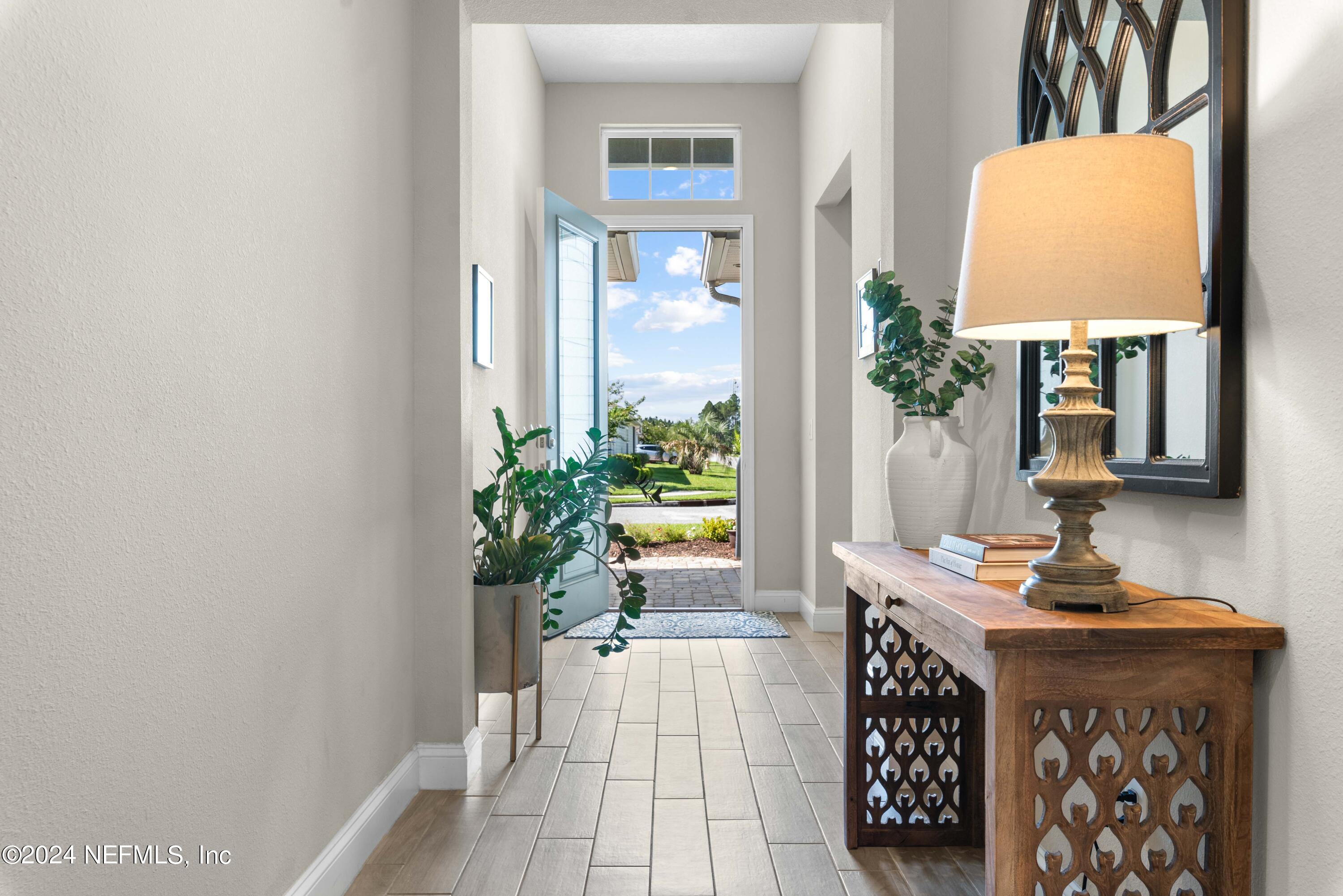 2672 Alexia Circle Jacksonville, FL 32246 - Photo 3 of 33 a room with furniture and a potted plant