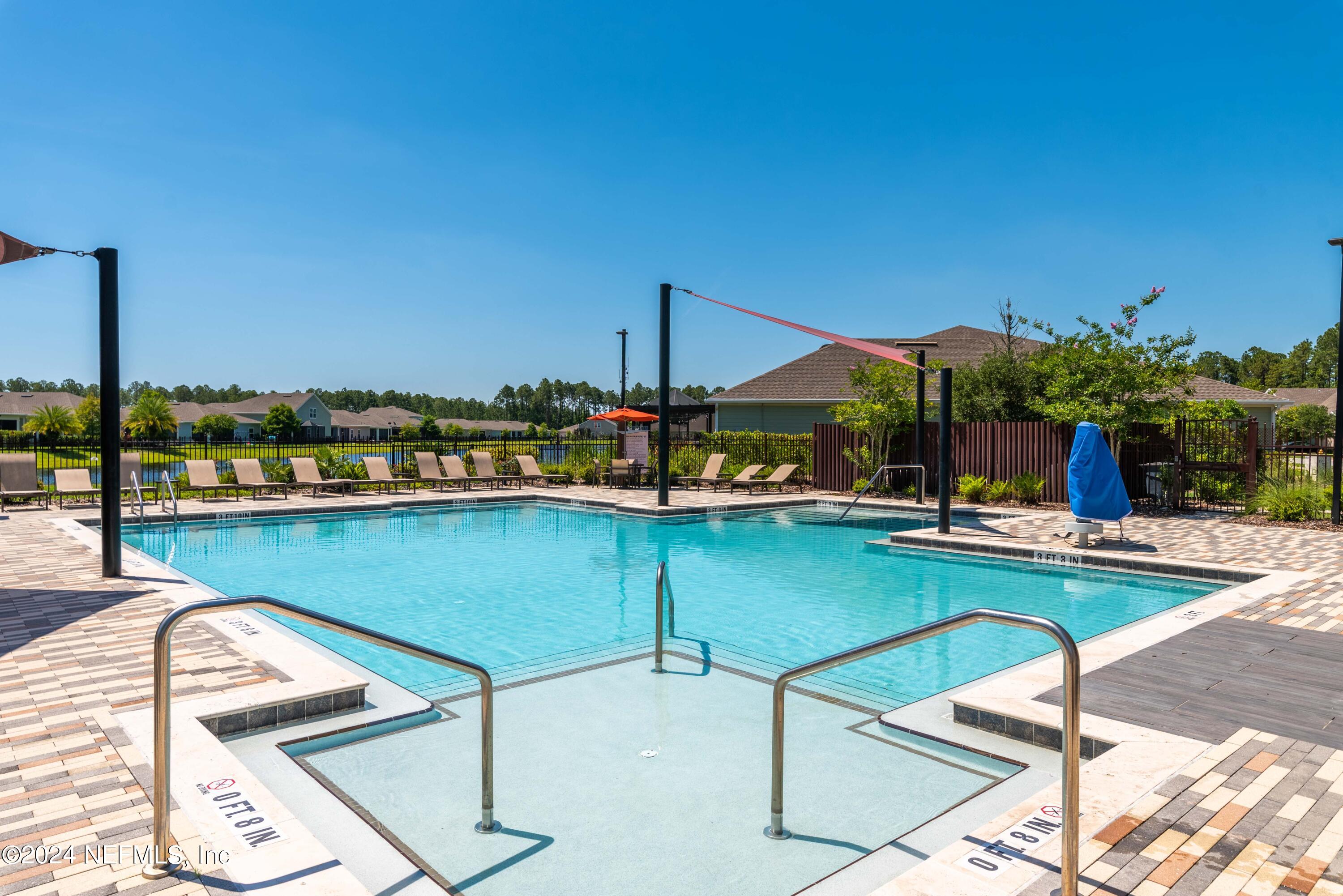 2672 Alexia Circle Jacksonville, FL 32246 - Photo 31 of 33 a view of a swimming pool with chairs