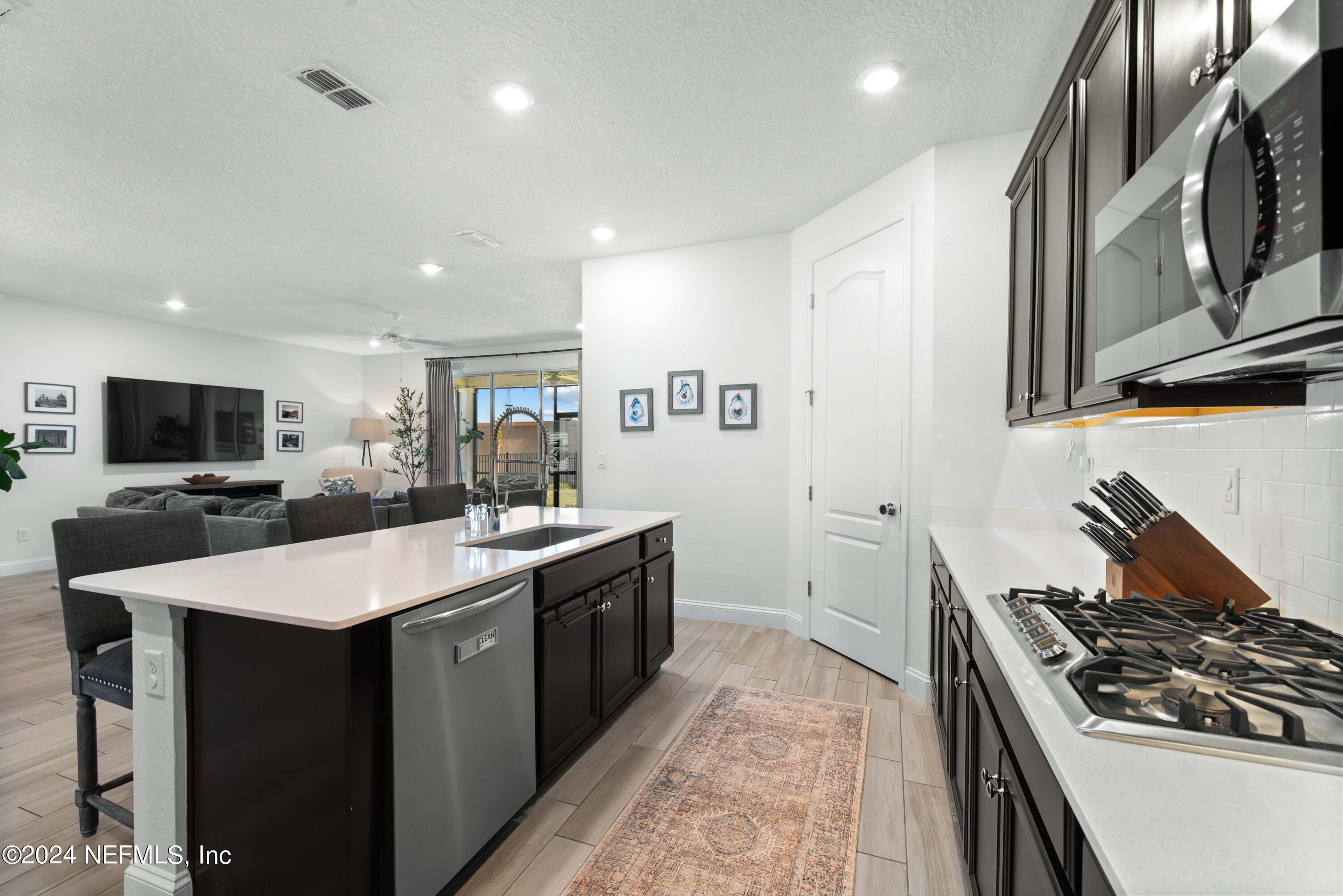 2672 Alexia Circle Jacksonville, FL 32246 - Photo 7 of 33 a kitchen with a stove and a sink