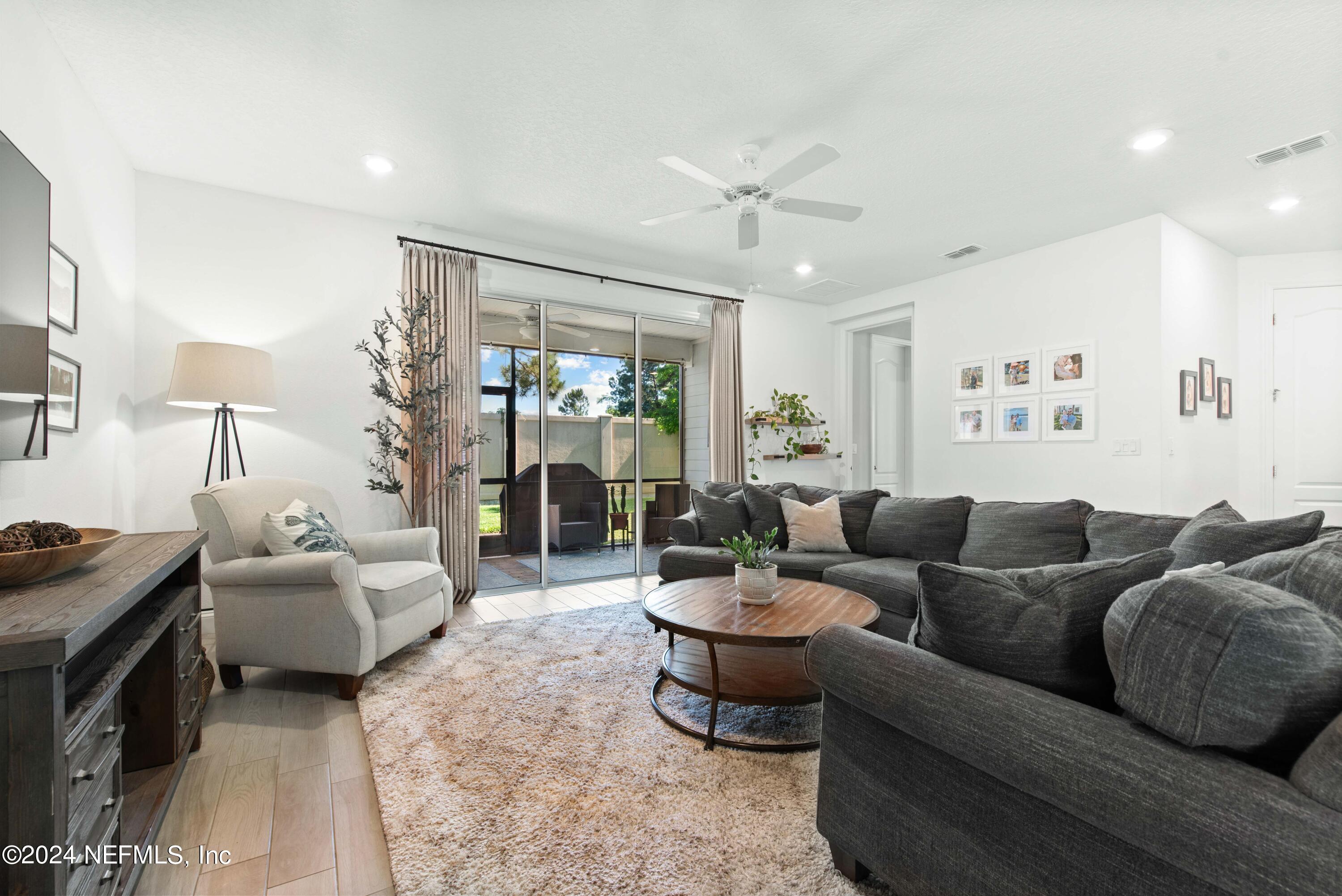2672 Alexia Circle Jacksonville, FL 32246 - Photo 10 of 33 a living room with furniture and a large window
