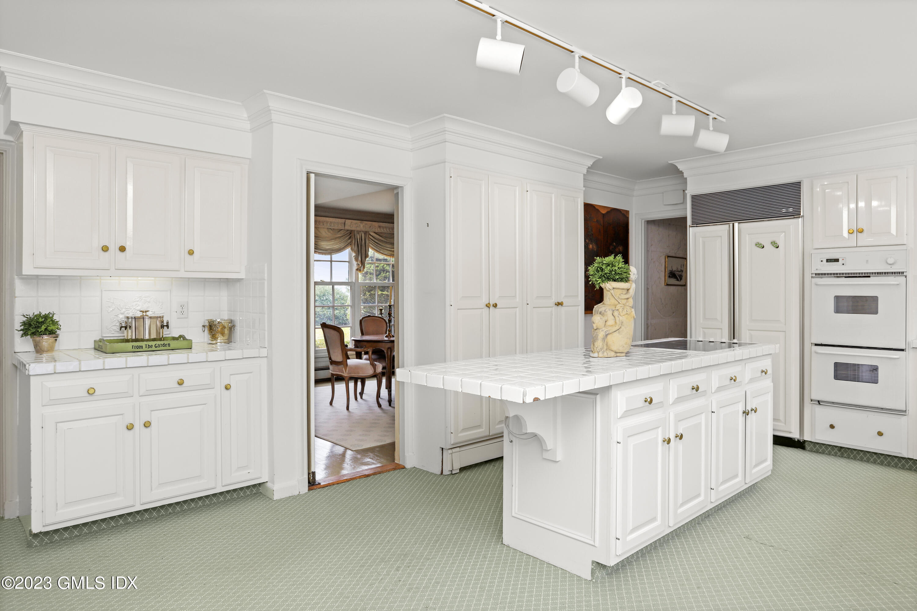 36 Golf Club Road Greenwich, CT 06830 - Photo 11 of 32 a kitchen with cabinets and window