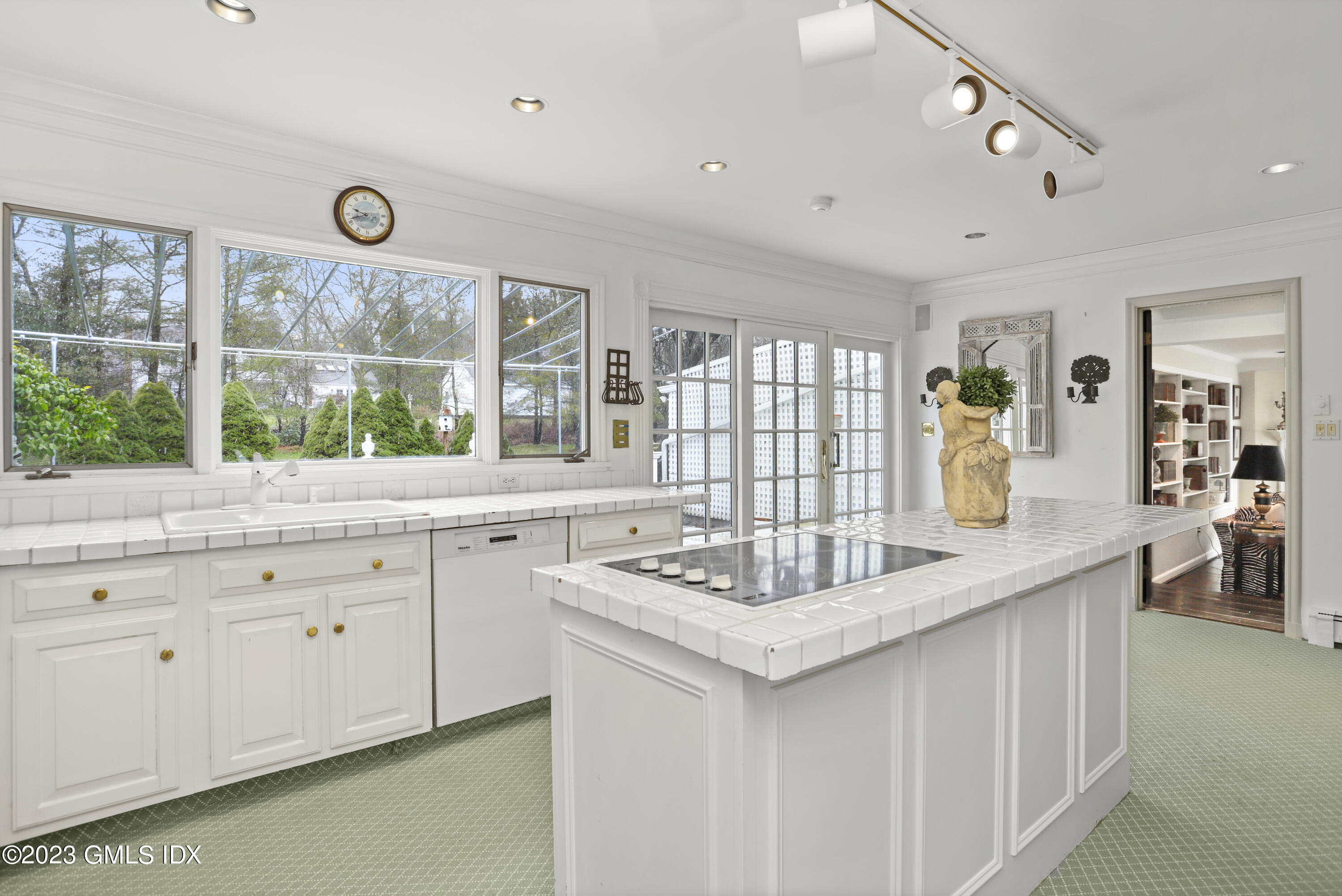 36 Golf Club Road Greenwich, CT 06830 - Photo 12 of 32 a kitchen with granite countertop a sink and a window