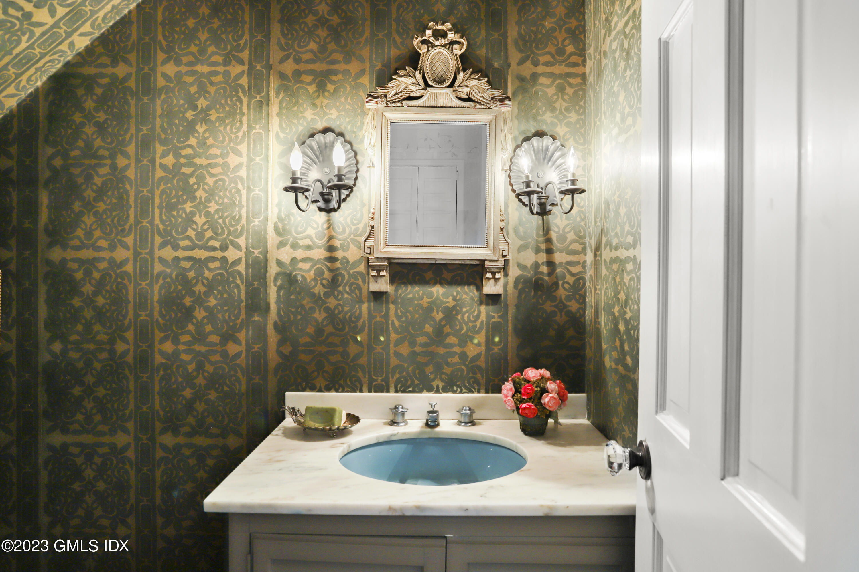 36 Golf Club Road Greenwich, CT 06830 - Photo 17 of 32 a bathroom with a sink and mirror