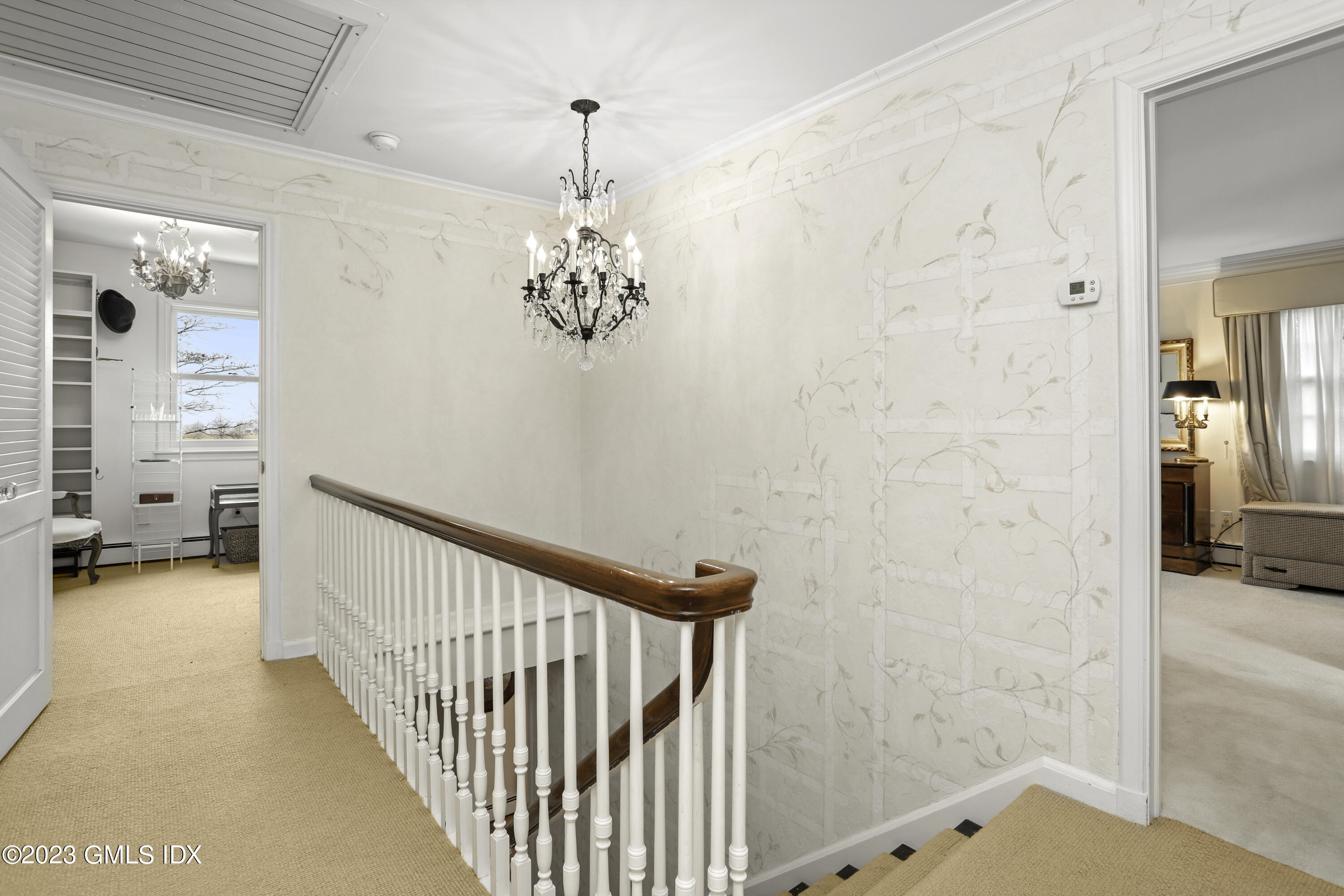 36 Golf Club Road Greenwich, CT 06830 - Photo 18 of 32 a view of a hallway to a livingroom with furniture