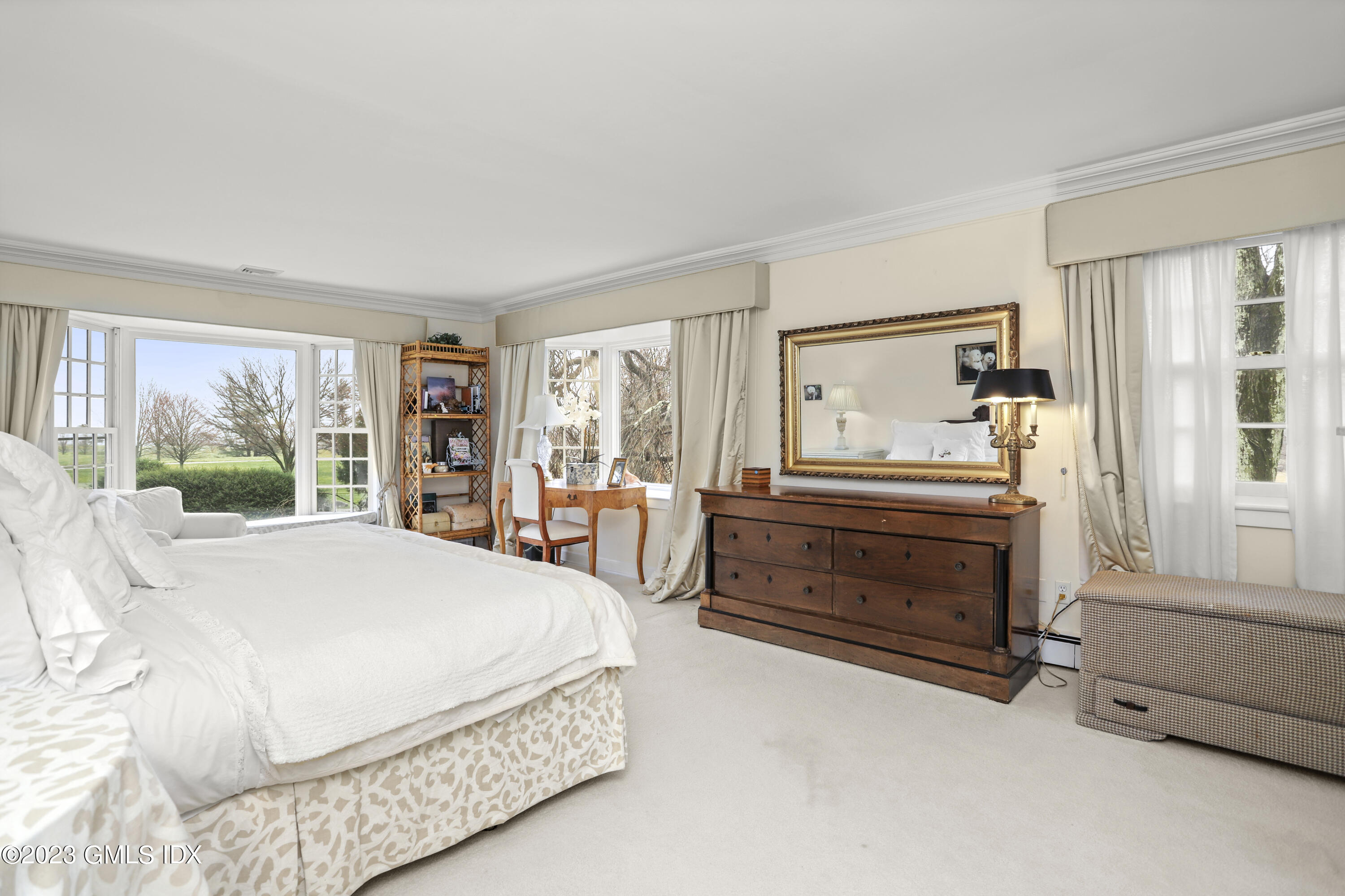 36 Golf Club Road Greenwich, CT 06830 - Photo 19 of 32 a bedroom with a bed and large window