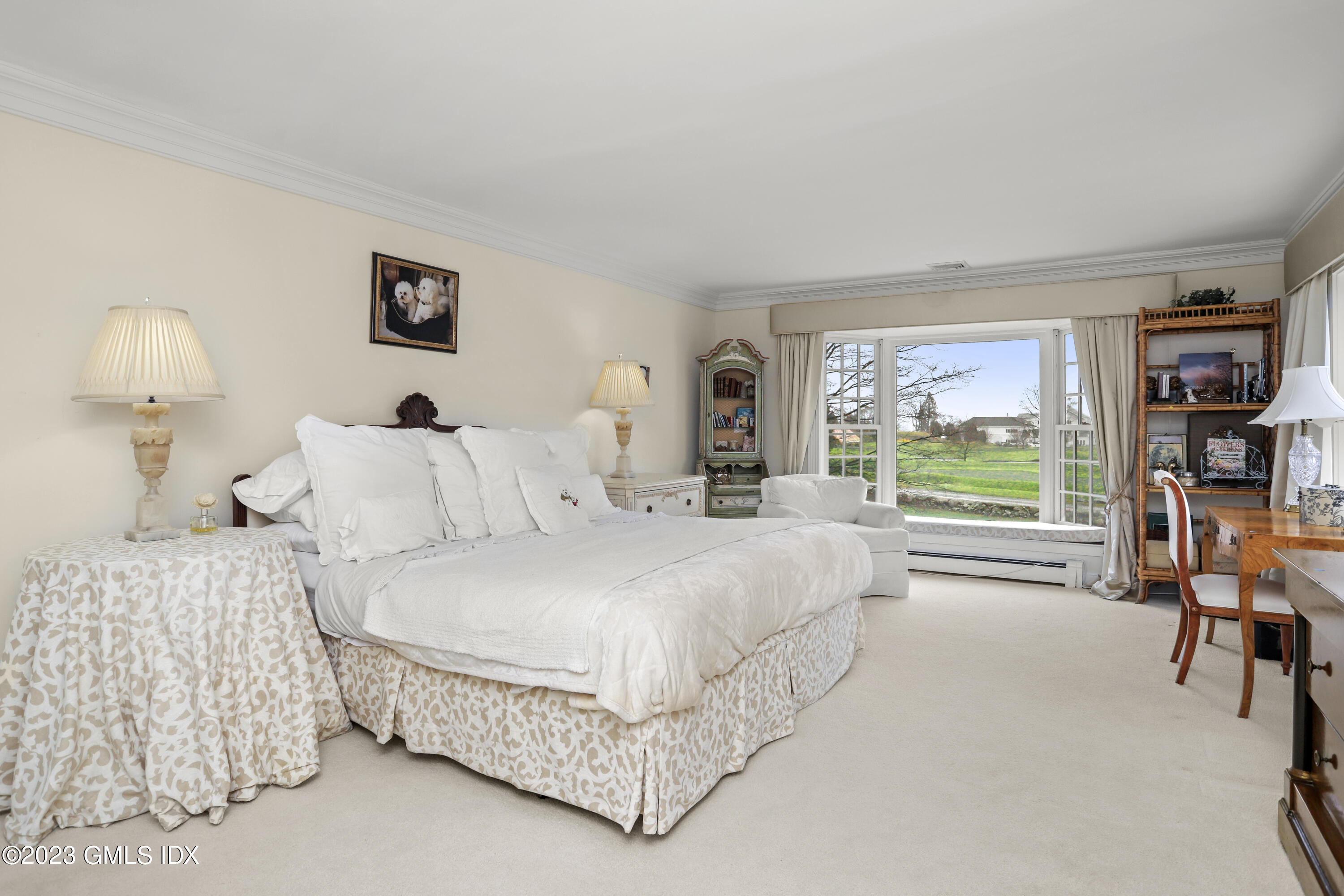 36 Golf Club Road Greenwich, CT 06830 - Photo 20 of 32 a bedroom with a large bed and a large window