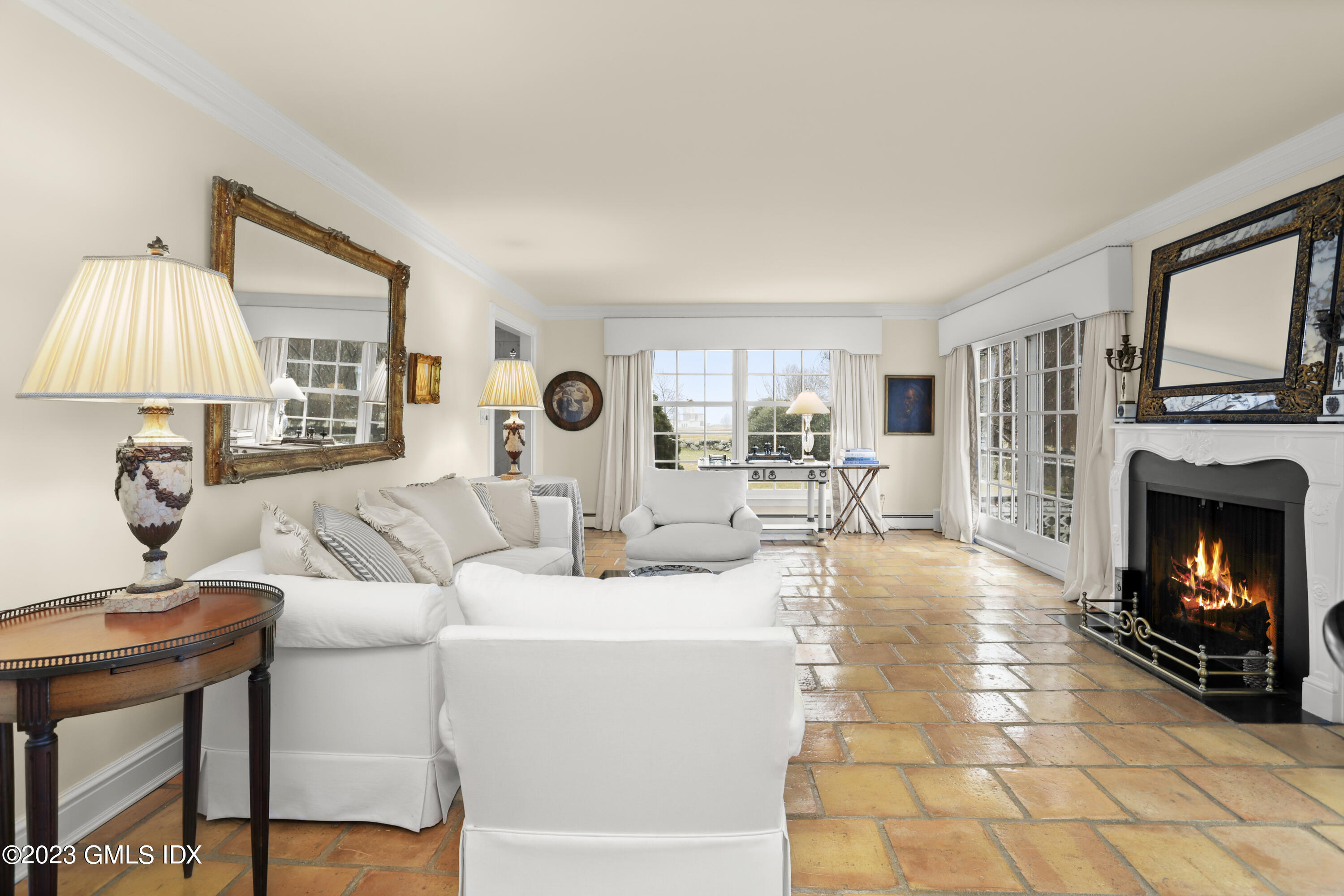 36 Golf Club Road Greenwich, CT 06830 - Photo 6 of 32 a living room with furniture a fireplace and a flat screen tv