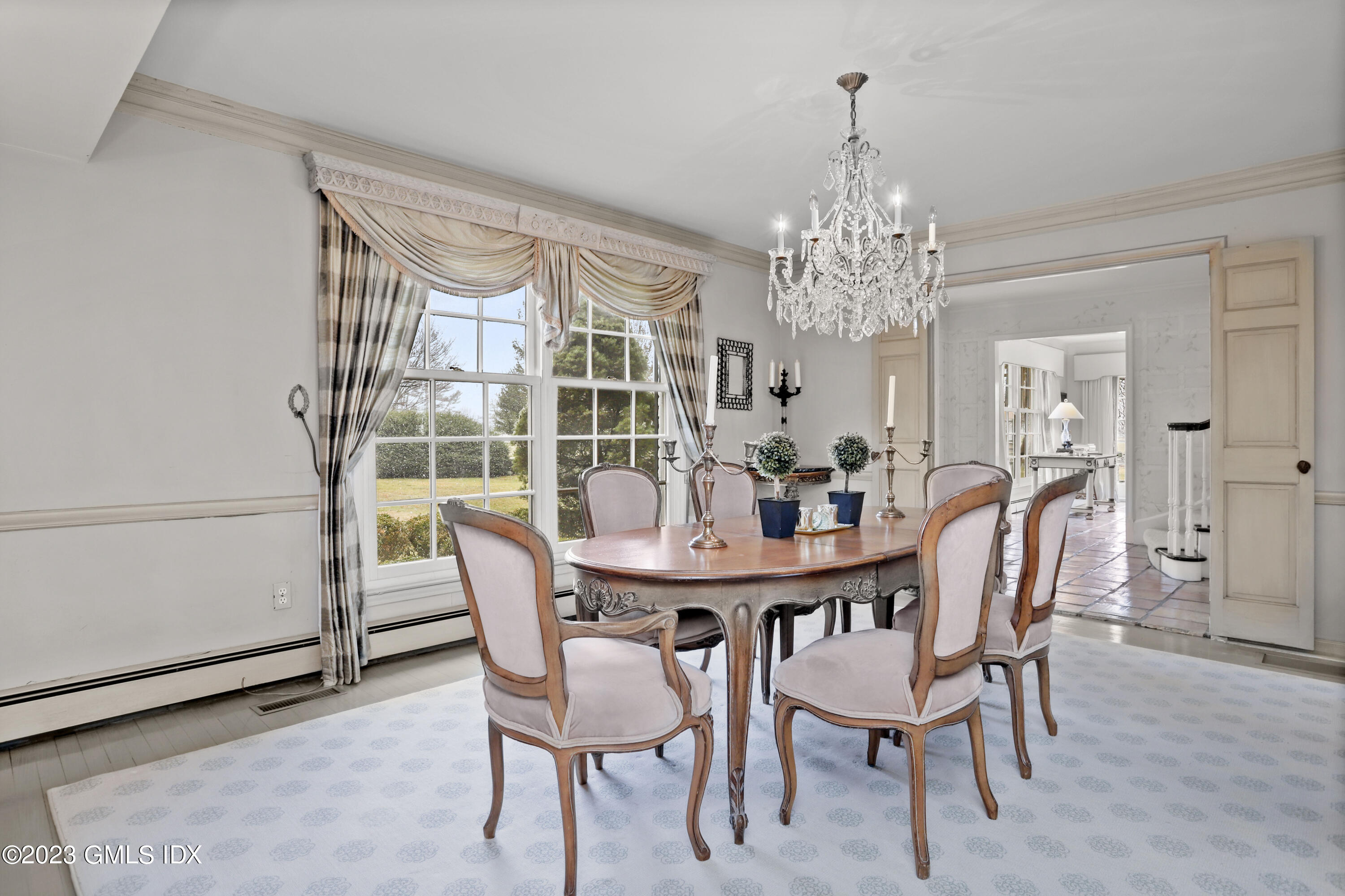 36 Golf Club Road Greenwich, CT 06830 - Photo 8 of 32 a view of a dining room with furniture and chandelier