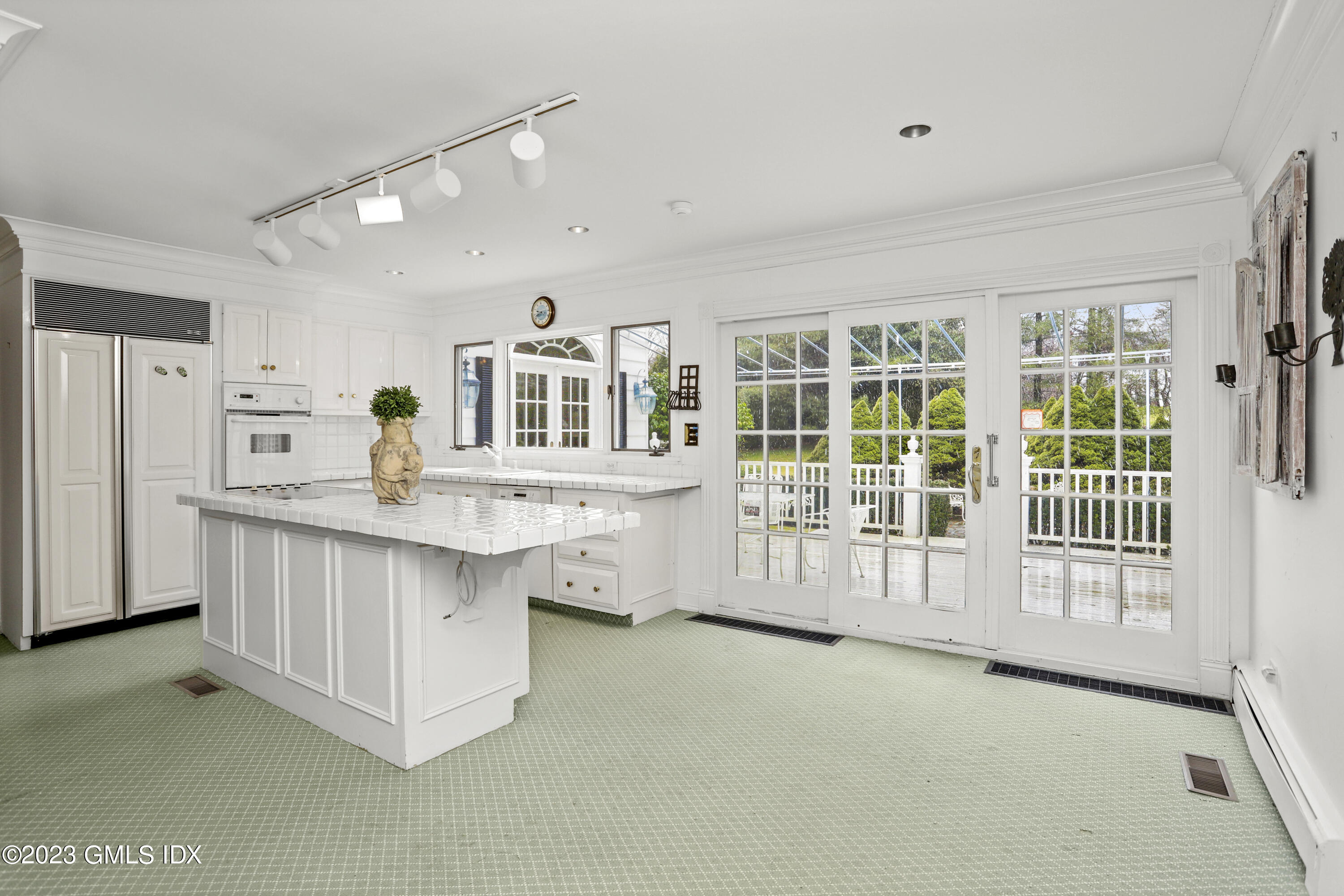 36 Golf Club Road Greenwich, CT 06830 - Photo 10 of 32 a kitchen with white cabinets and window