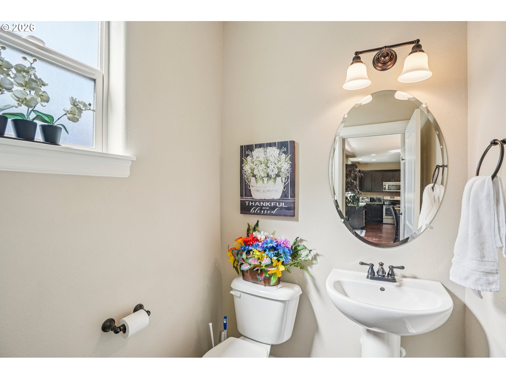 16958 Southwest Kavitt Lane Beaverton, OR 97078 - Photo 13 of 30 a bathroom with a sink mirror and window