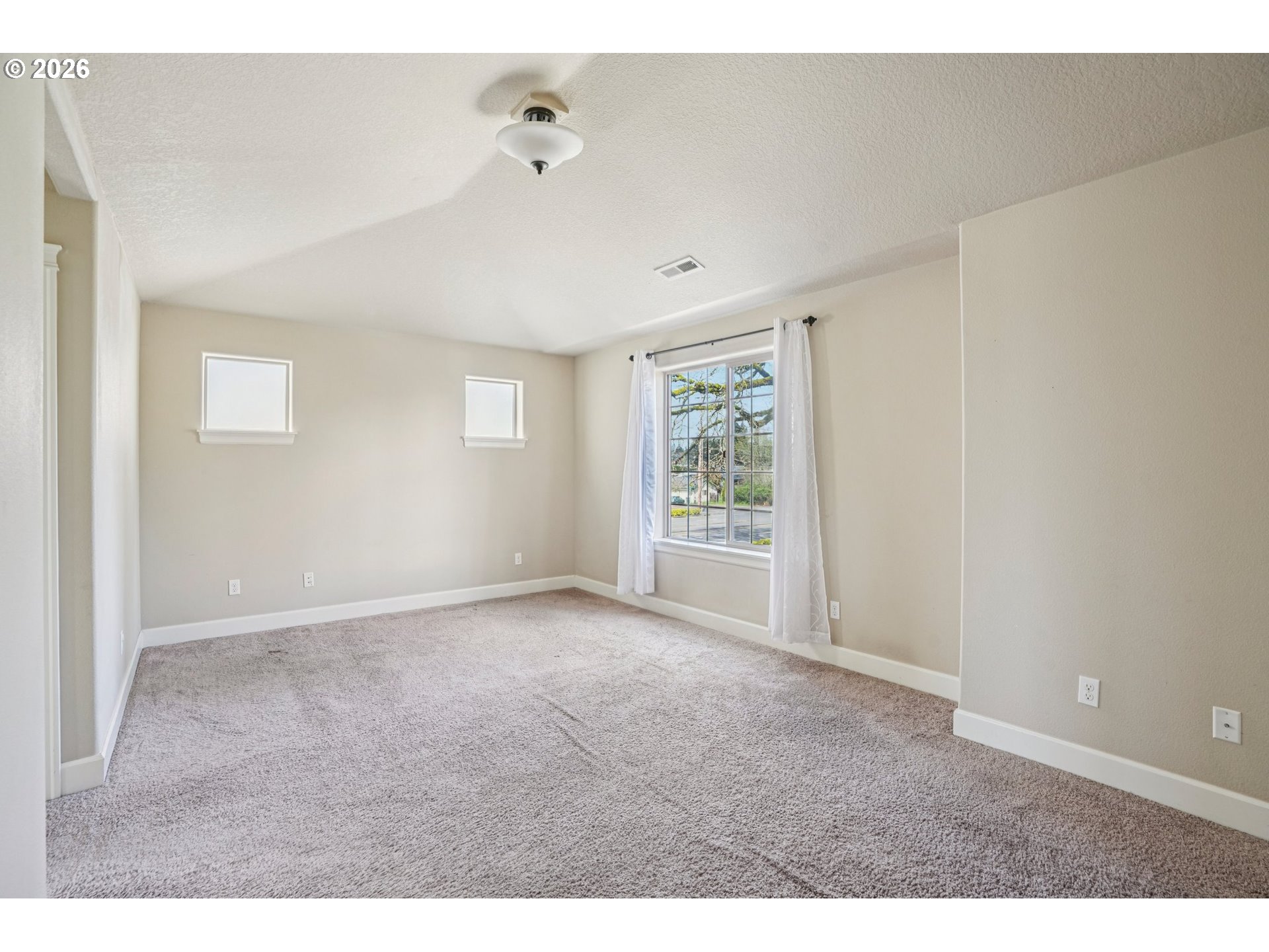16958 Southwest Kavitt Lane Beaverton, OR 97078 - Photo 14 of 30 a view of an empty room with a window
