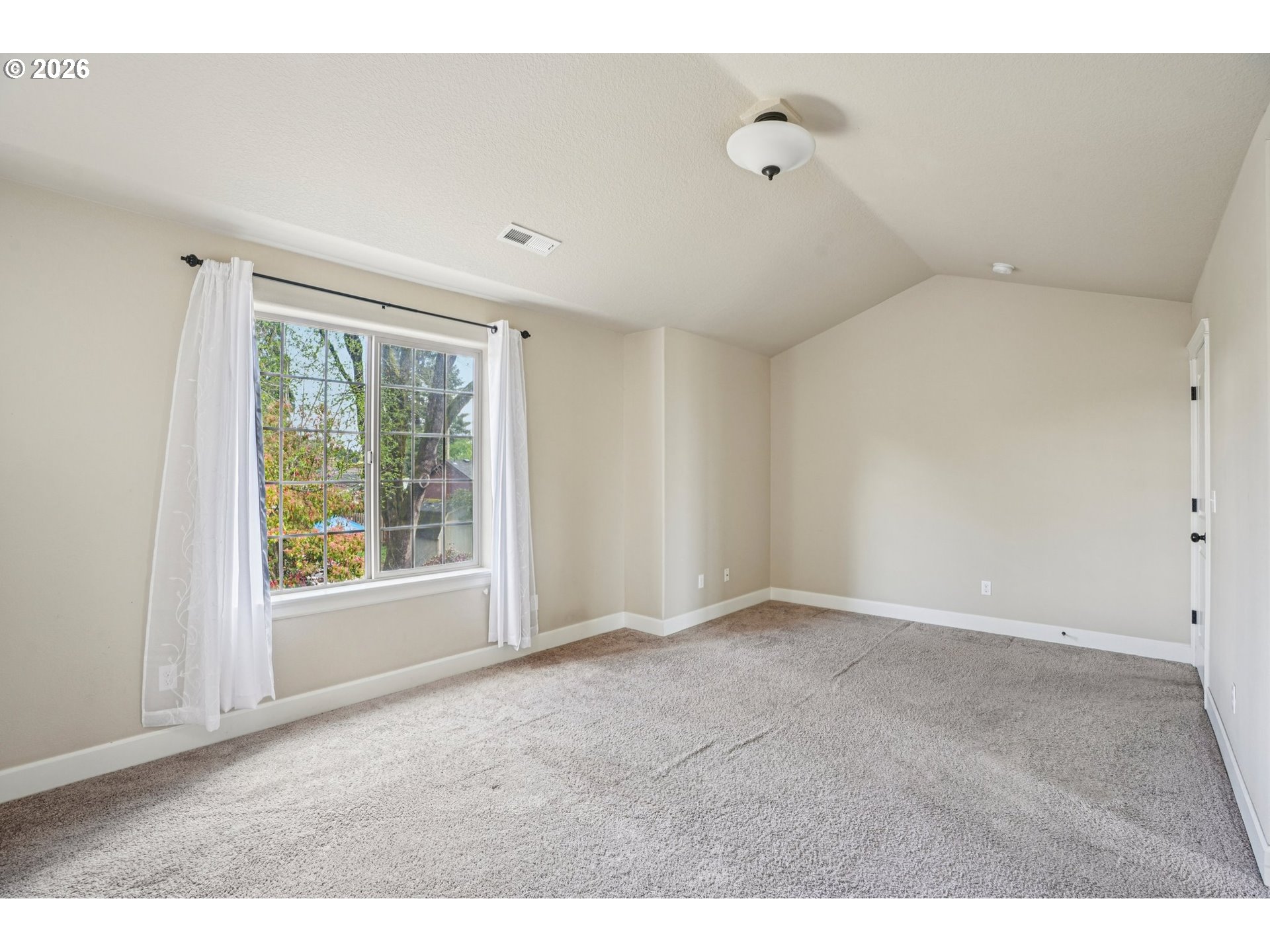 16958 Southwest Kavitt Lane Beaverton, OR 97078 - Photo 16 of 30 a view of an empty room with a window