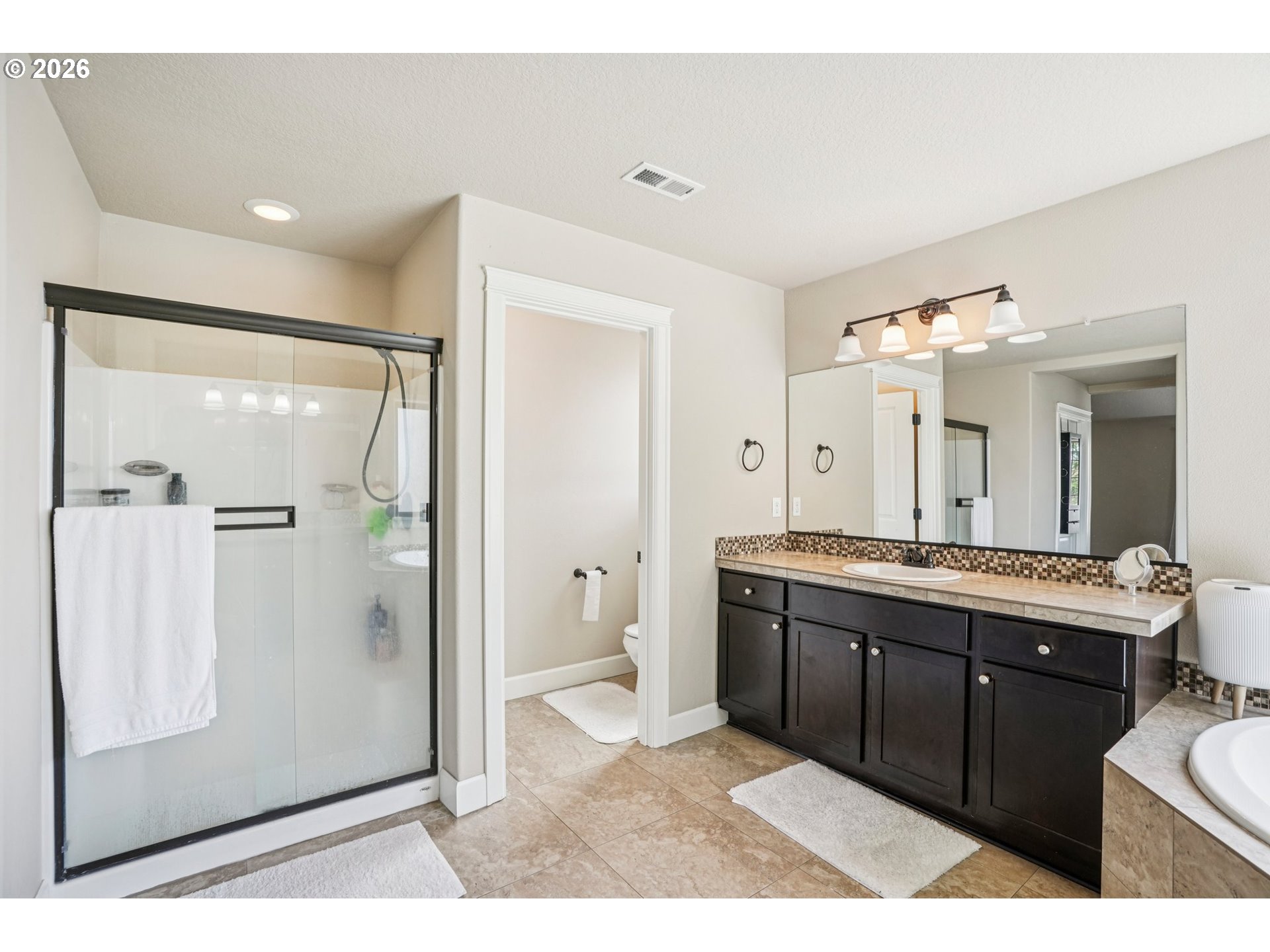 16958 Southwest Kavitt Lane Beaverton, OR 97078 - Photo 18 of 30 a bathroom with a double vanity sink mirror and toilet