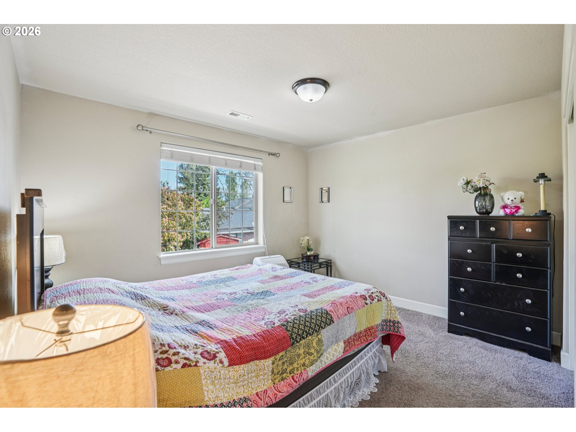 16958 Southwest Kavitt Lane Beaverton, OR 97078 - Photo 25 of 30 a bedroom with a bed and a dresser