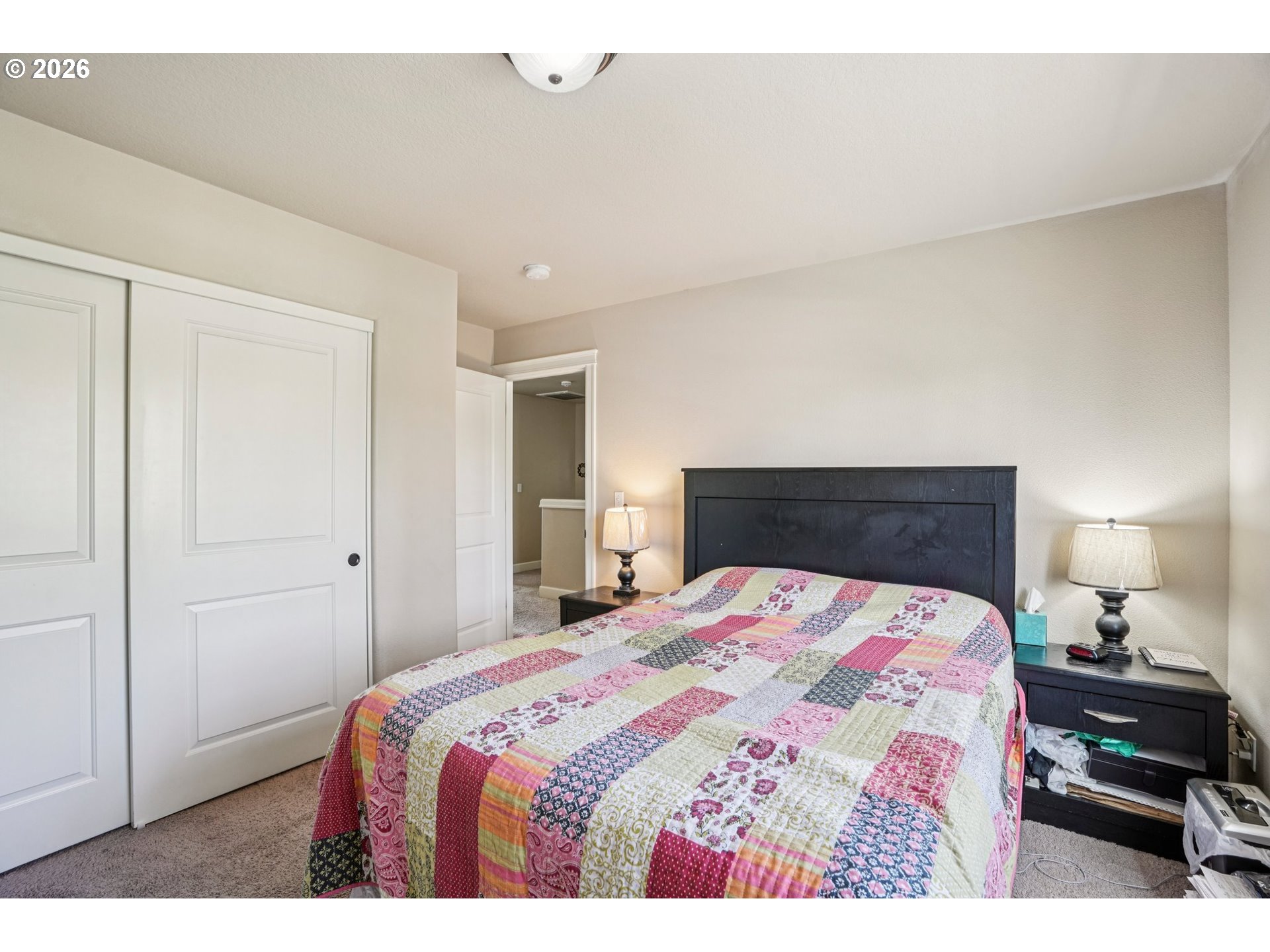 16958 Southwest Kavitt Lane Beaverton, OR 97078 - Photo 26 of 30 a bedroom with a bed and a lamp