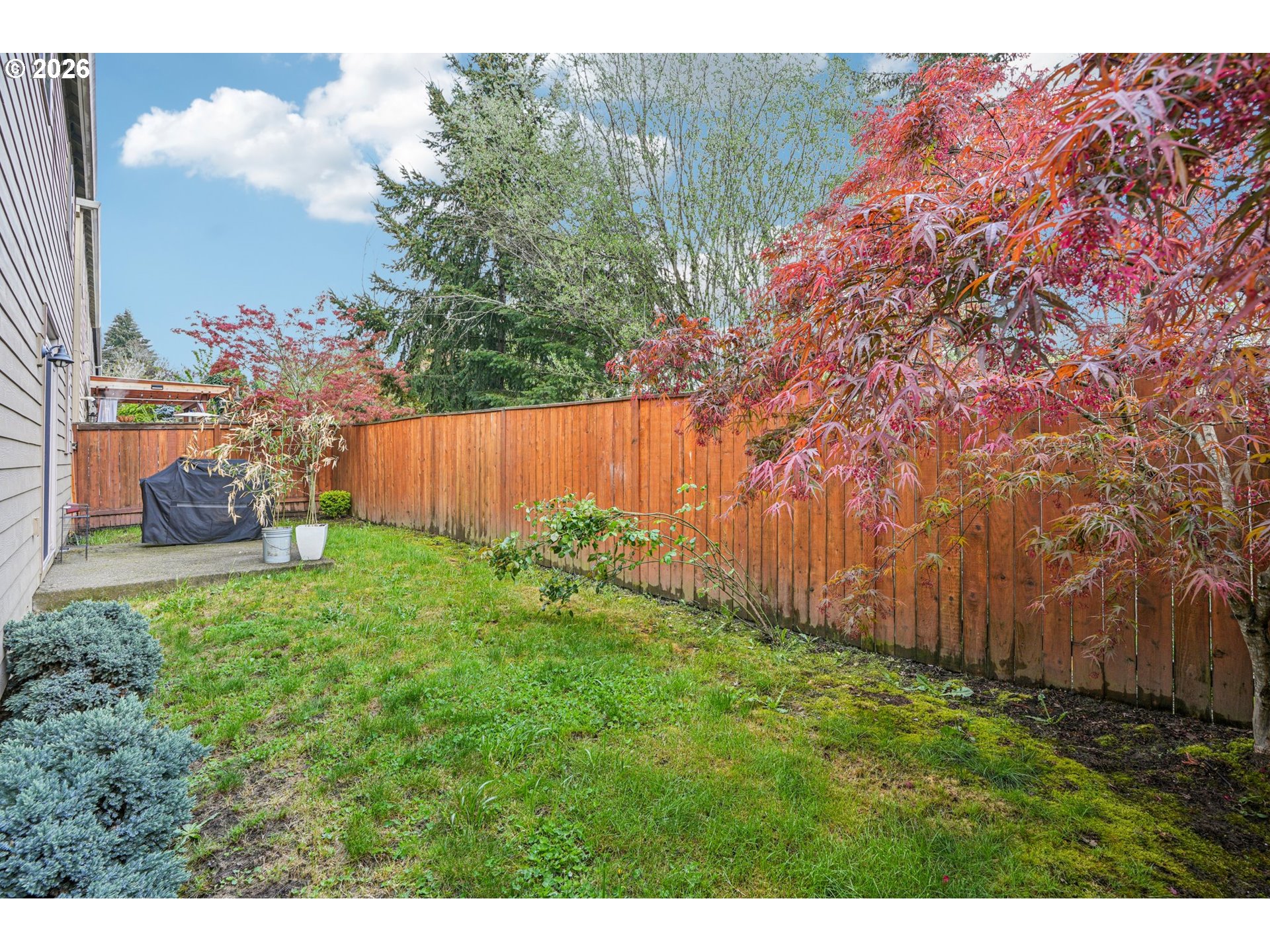 16958 Southwest Kavitt Lane Beaverton, OR 97078 - Photo 29 of 30 a backyard of a house with lots of green space
