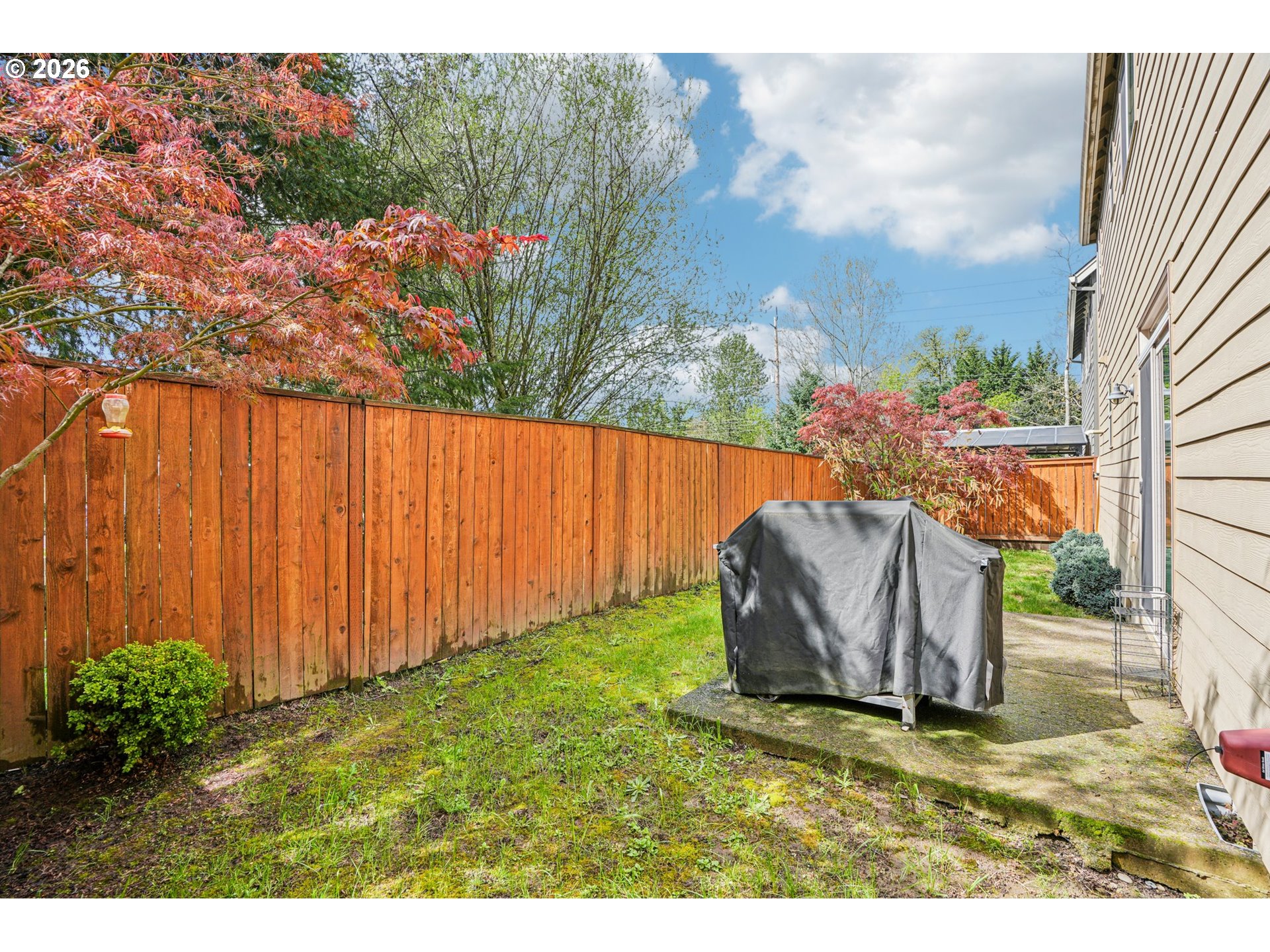 16958 Southwest Kavitt Lane Beaverton, OR 97078 - Photo 30 of 30 a backyard of a house with lots of green space