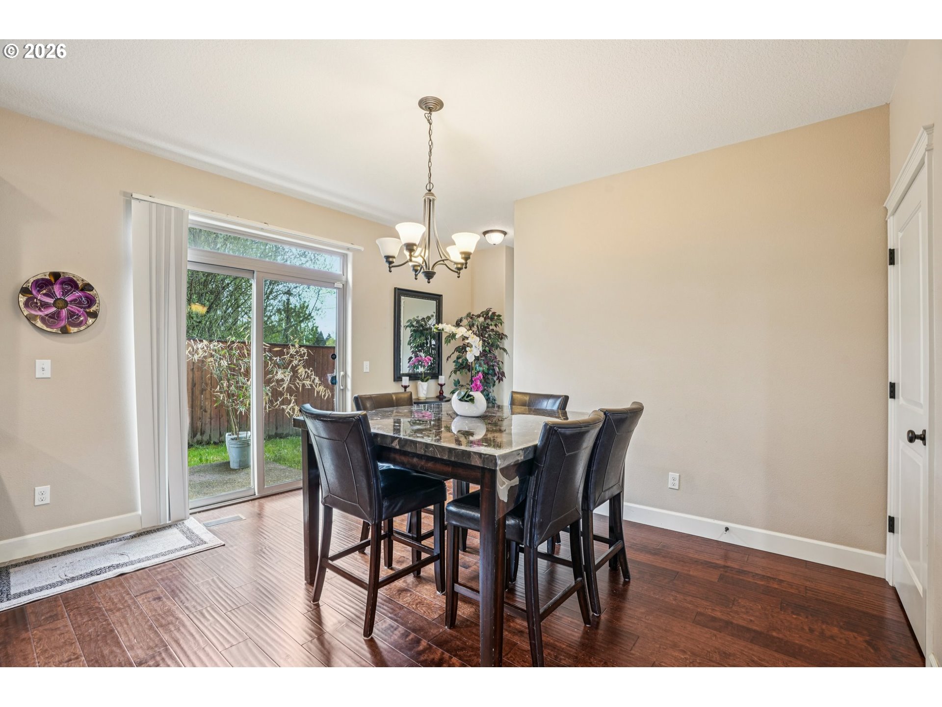 16958 Southwest Kavitt Lane Beaverton, OR 97078 - Photo 6 of 30 a view of a dining room with furniture window and wooden floor