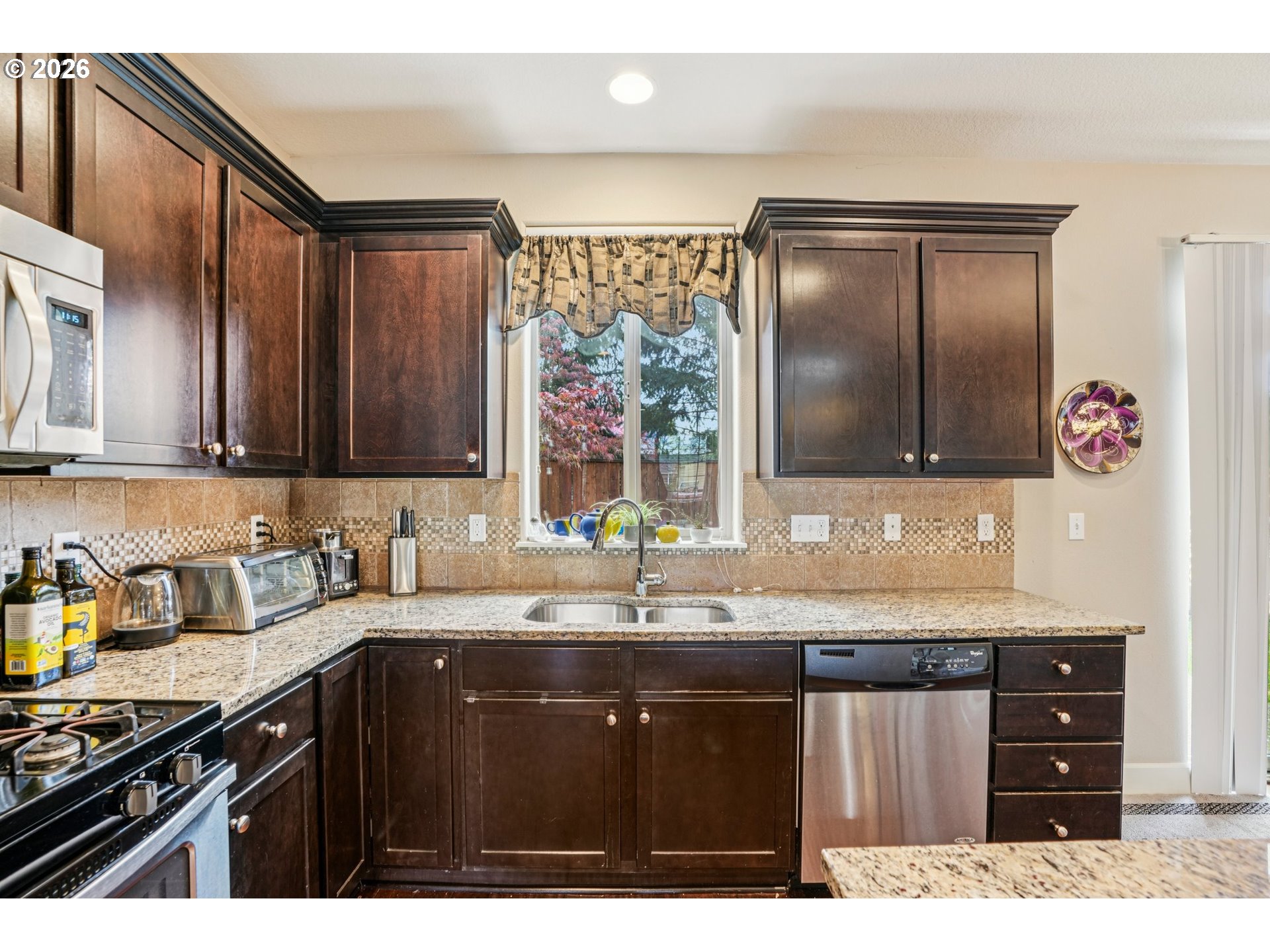 16958 Southwest Kavitt Lane Beaverton, OR 97078 - Photo 10 of 30 a kitchen with a sink and cabinets