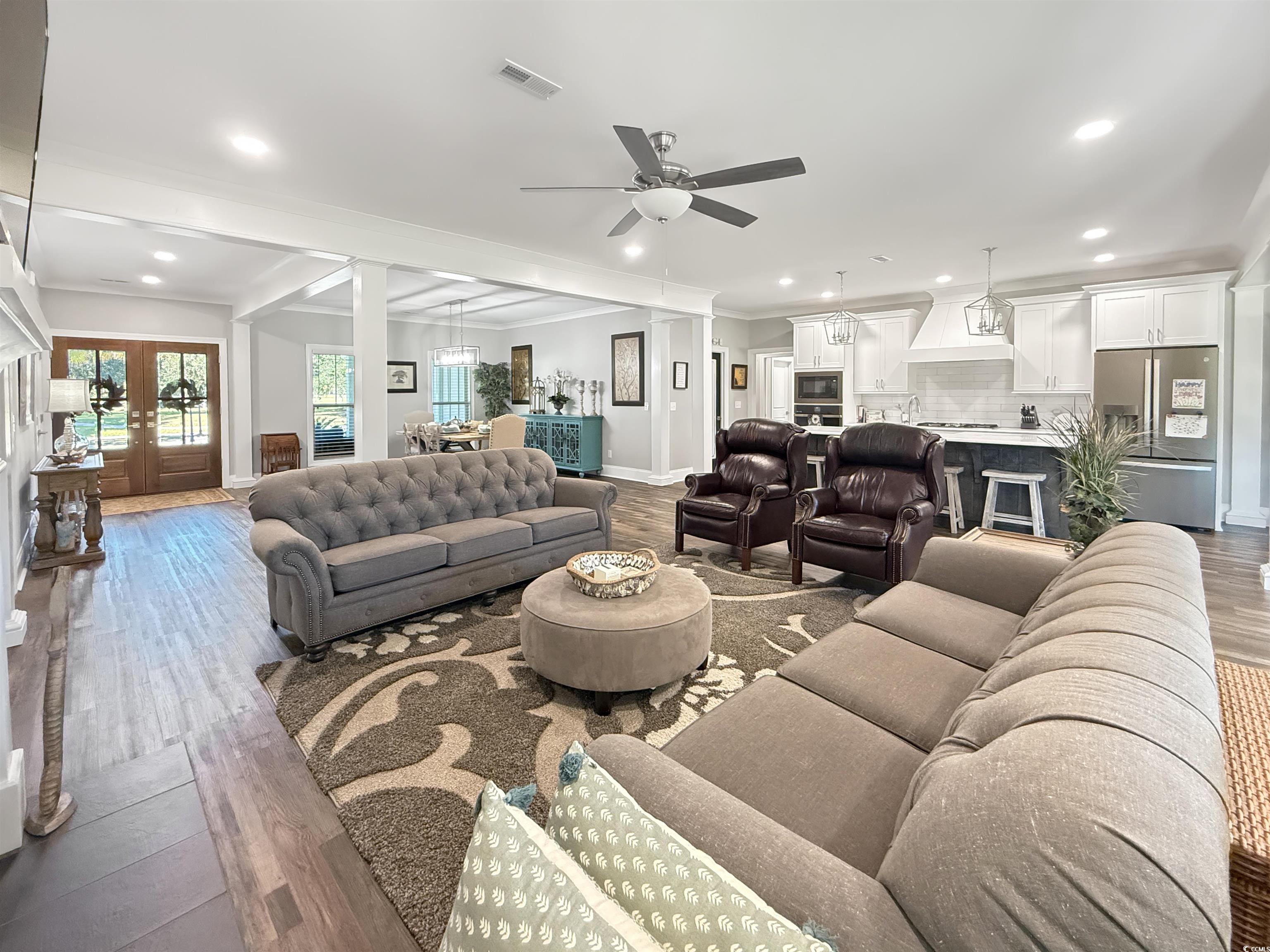 521 Oak Lawn Road Georgetown, SC 29440 - Photo 12 of 40 Living room with recessed lighting, dark wood-style flooring, a ceiling fan, ornamental molding, and french doors